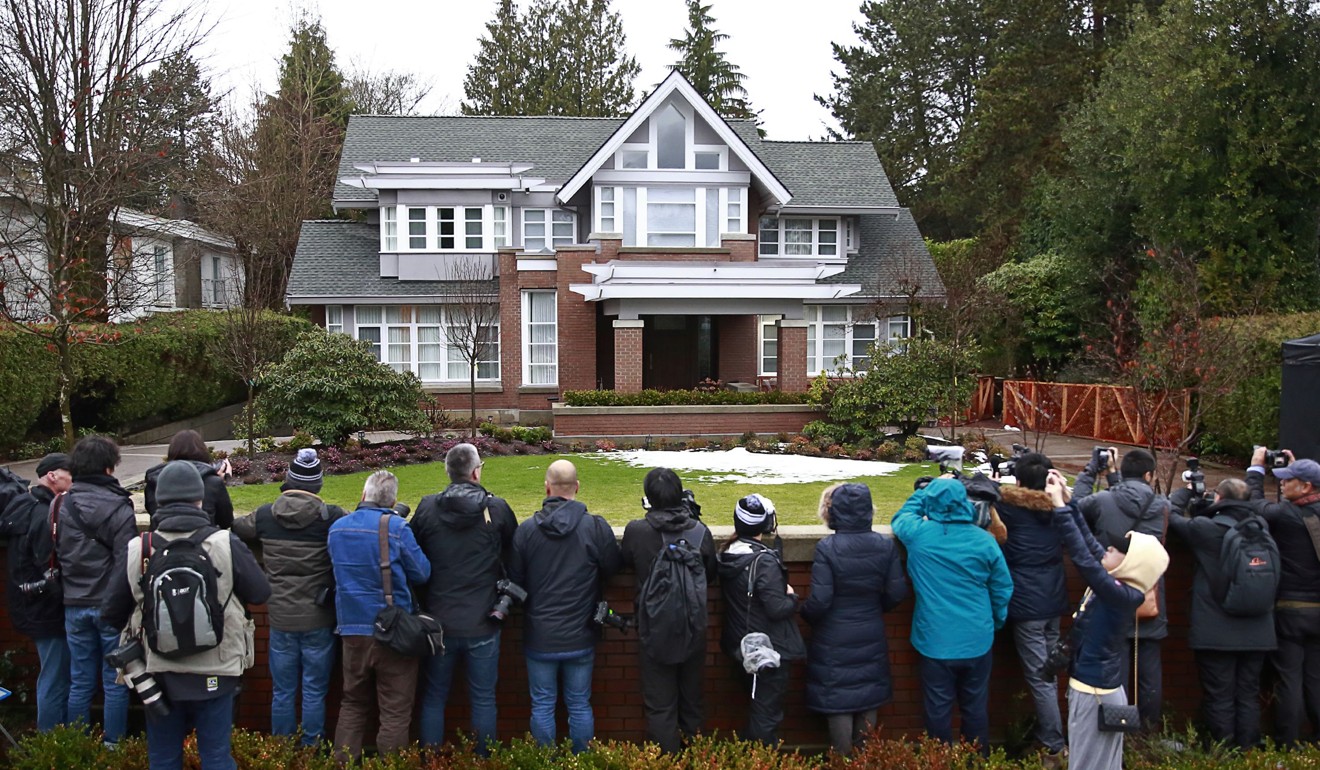 Photographers wait outside the Vancouver home of Huawei Technologies Chief Financial Officer Meng Wanzhou on Monday. Photo: AFP