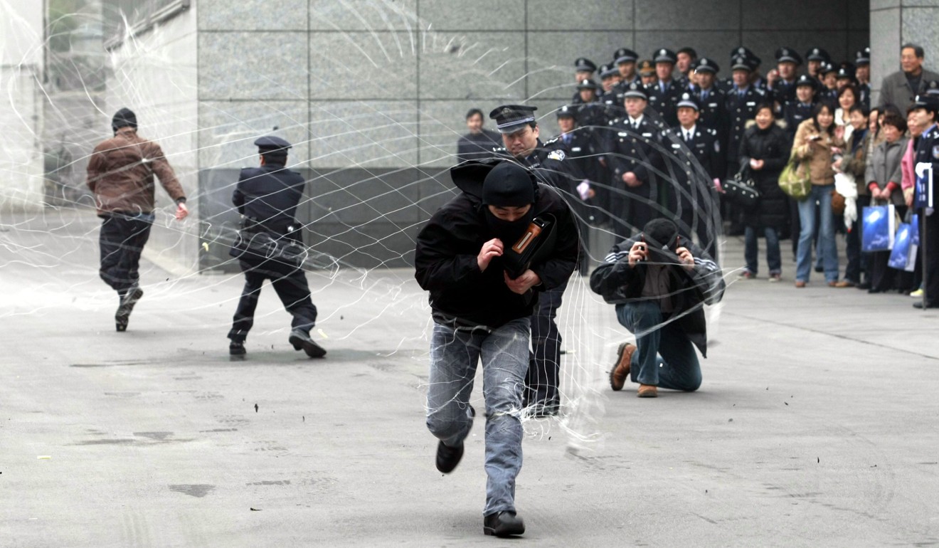 Police in Shanghai demonstrate the use of a net gun. Photo: Reuters