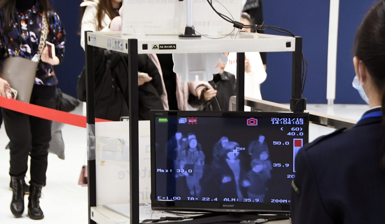 Travellers from Wuhan pass body temperature scanners at Japan’s Narita airport on January 16, 2020. Photo: Kyodo