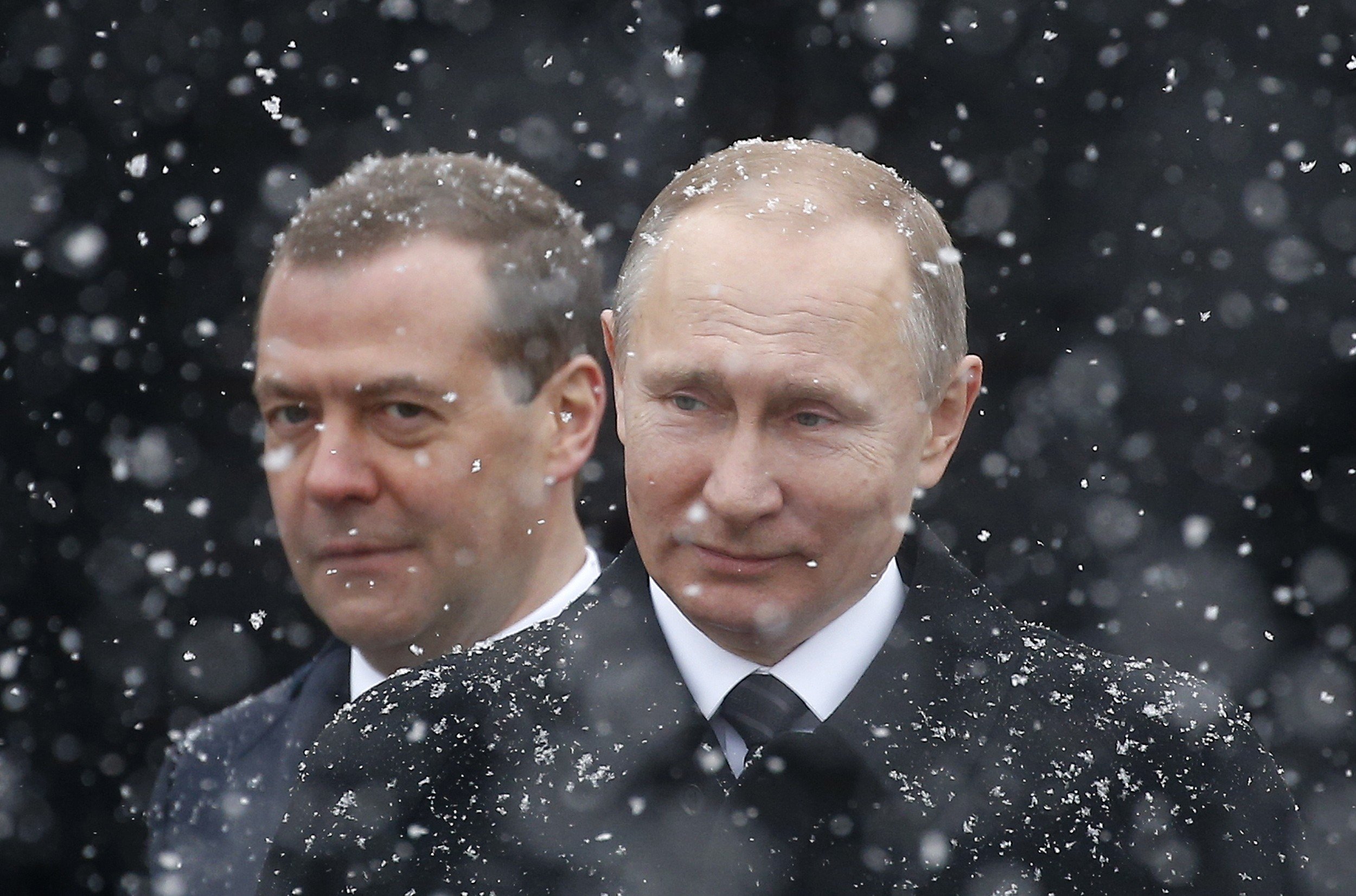 Vladimir Putin (foreground) and Dmitry Medvedev. Photo: EPA