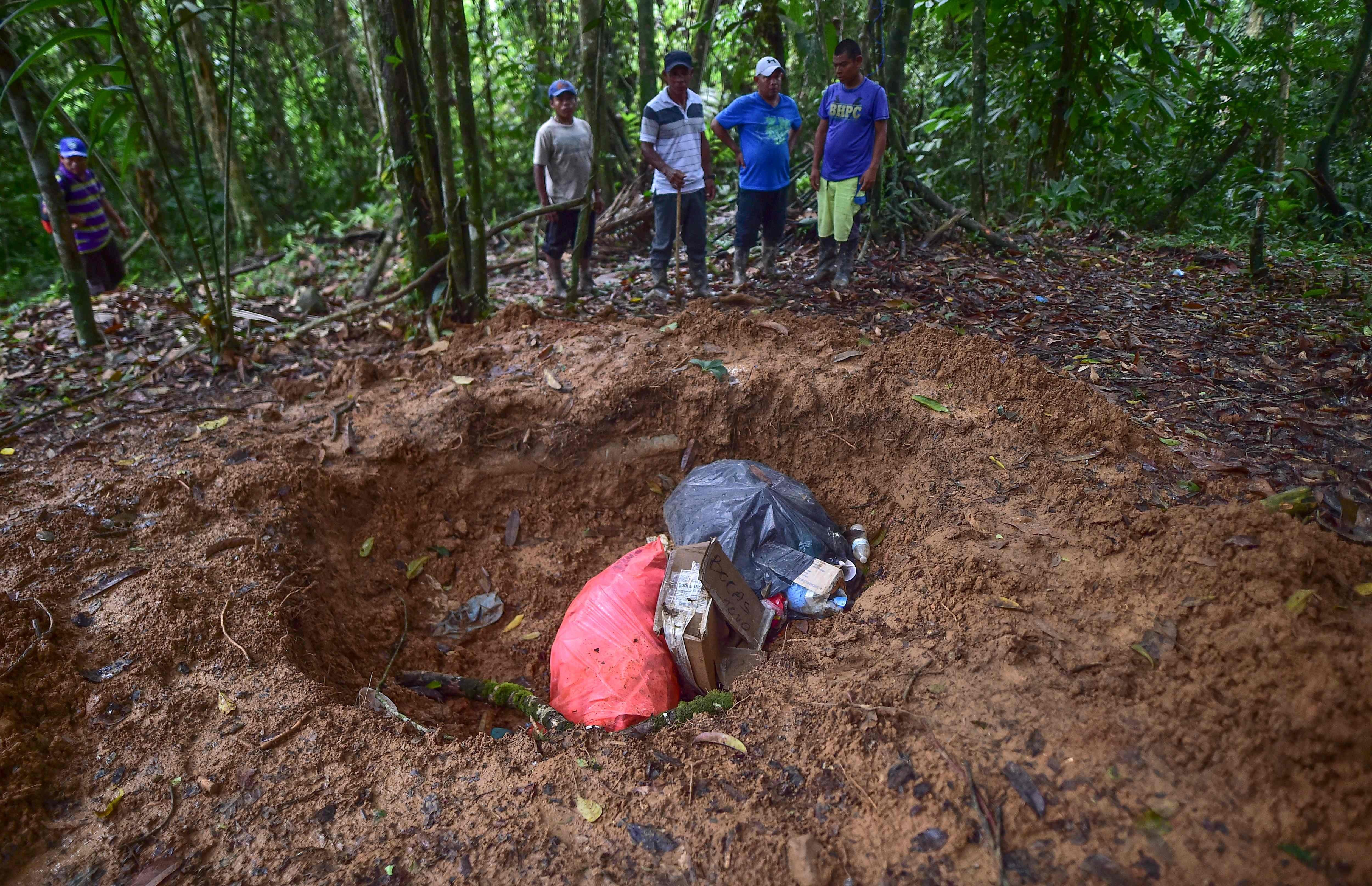 A mass grave where the bodies of a pregnant woman, five of her children and a sixth minor were killed in a religious sacrifice. Photo: AFP