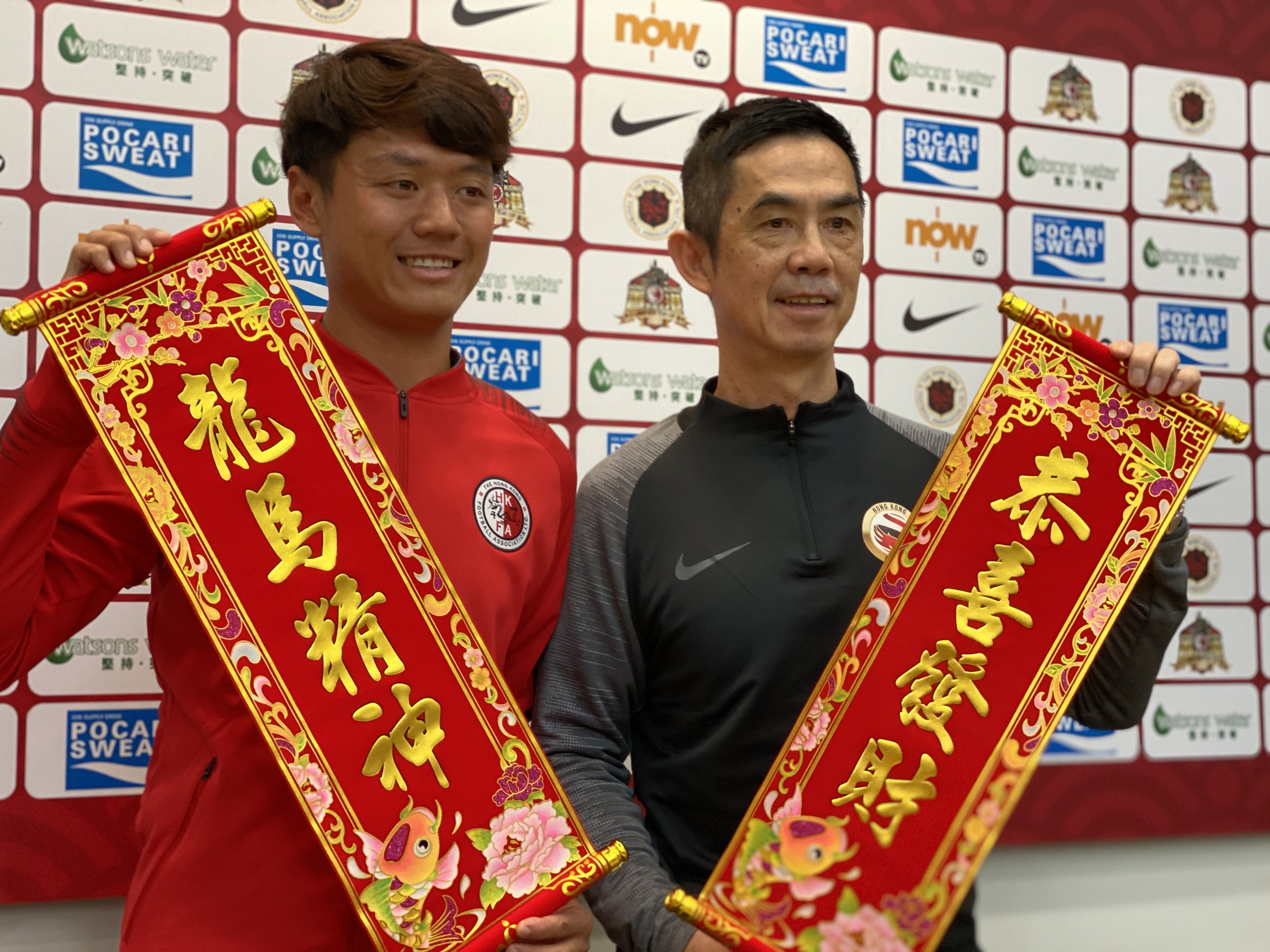 Hong Kong coach Cheung Kin-fung (left) and League Selection XI counterpart Liu Chun-fai promoting the Lunar New Year before it was cancelled on Thursday night. Photo: Chan Kin-wa