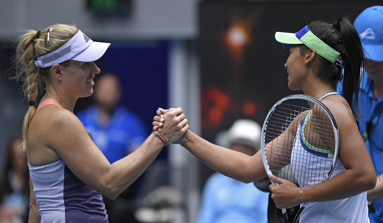 Germany's Angelique Kerber (left) is congratulated by Australia's Priscilla Hon after winning their second round match at the Australian Open. Photo: AP
