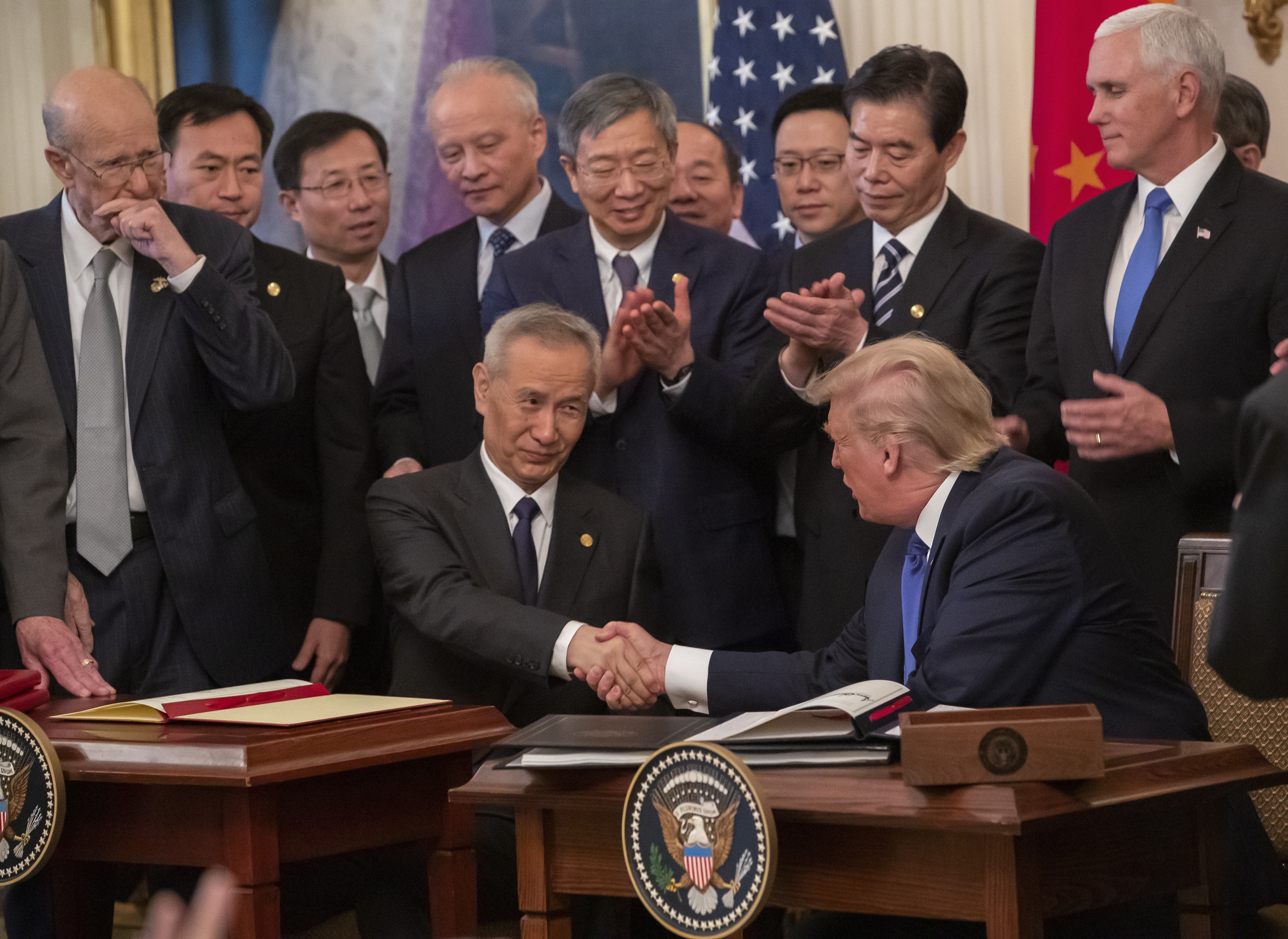 Chinese Vice Premier Liu He and US President Donald Trump sign the trade agreement on January 15. Photo: EPA