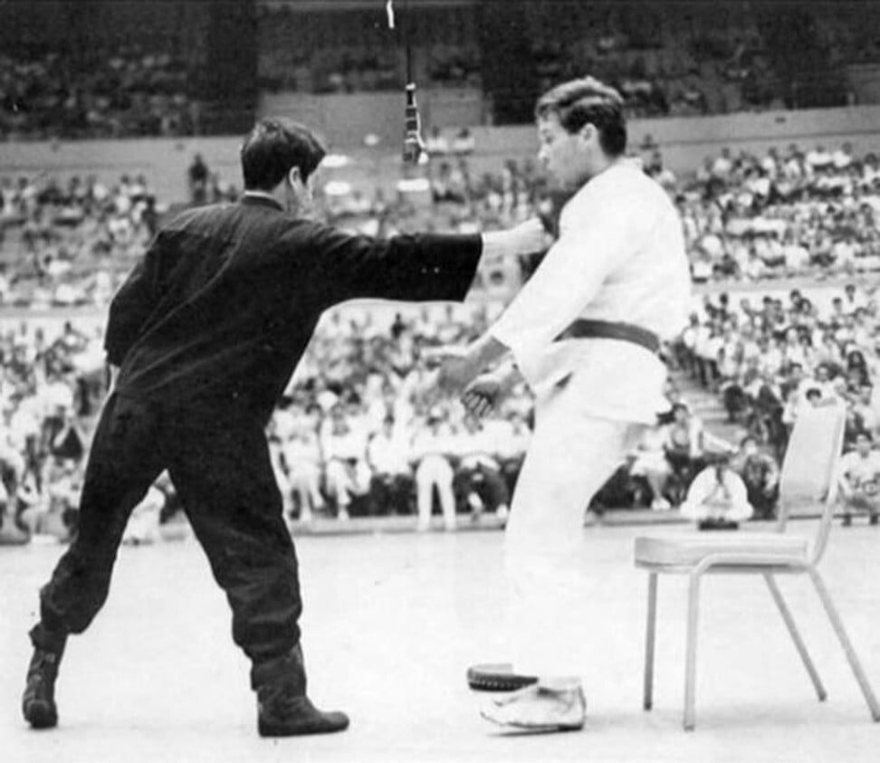 Bruce Lee demonstrates his famous one-inch punch at the Long Beach International Karate Championships in 1964.