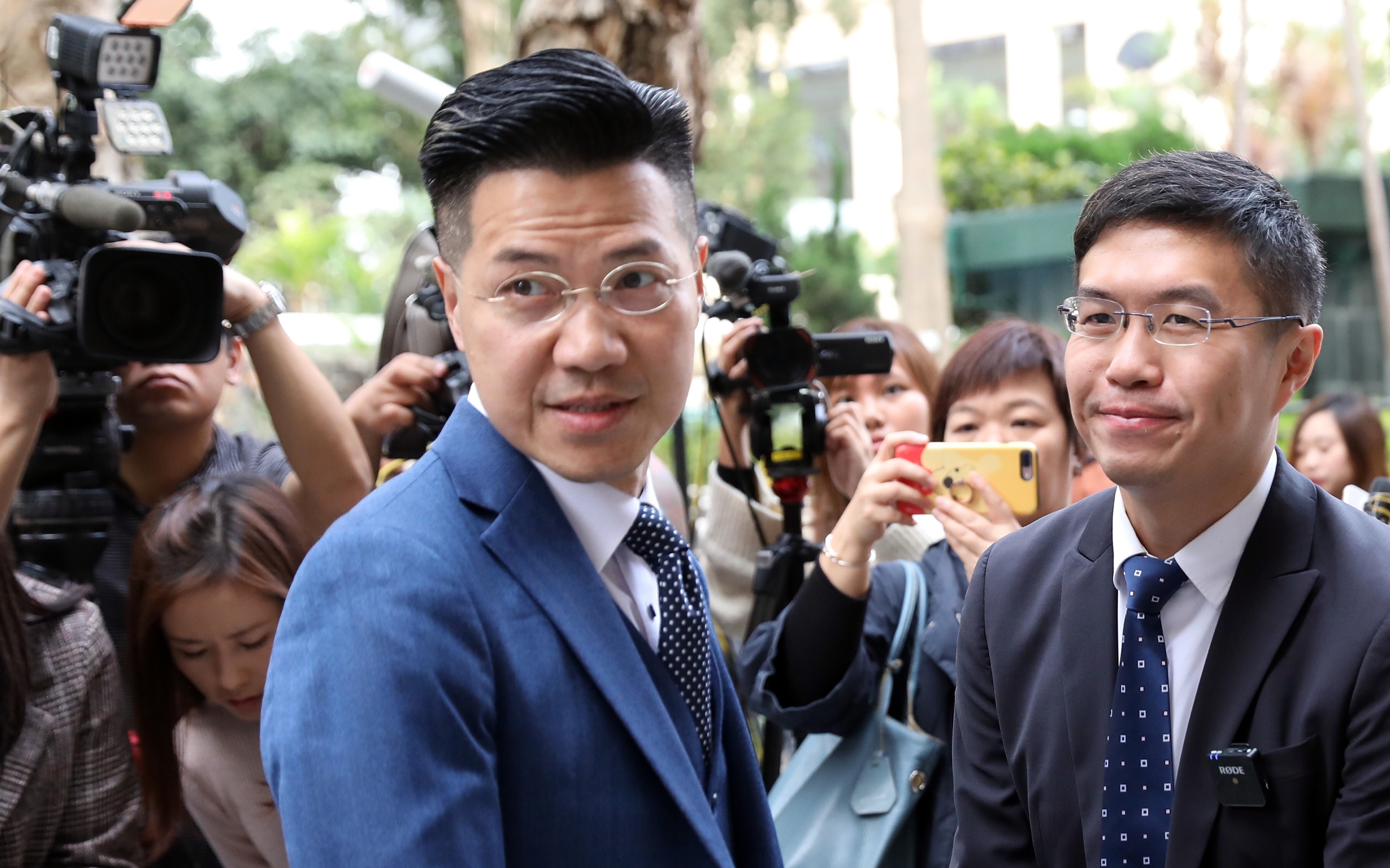 Pro-democracy lawmakers Gary Fan Kwok-wai (left) and Au Nok-hin at the Court of Final Appeal in Central on December 17. They were unseated when a court ruling rendered them unduly elected, because of the bungled disqualification of two other pro-democracy candidates ahead of a Legislative Council by-election in March 2018. Fan and Au had then contested those seats and won. Photo: Nora Tam