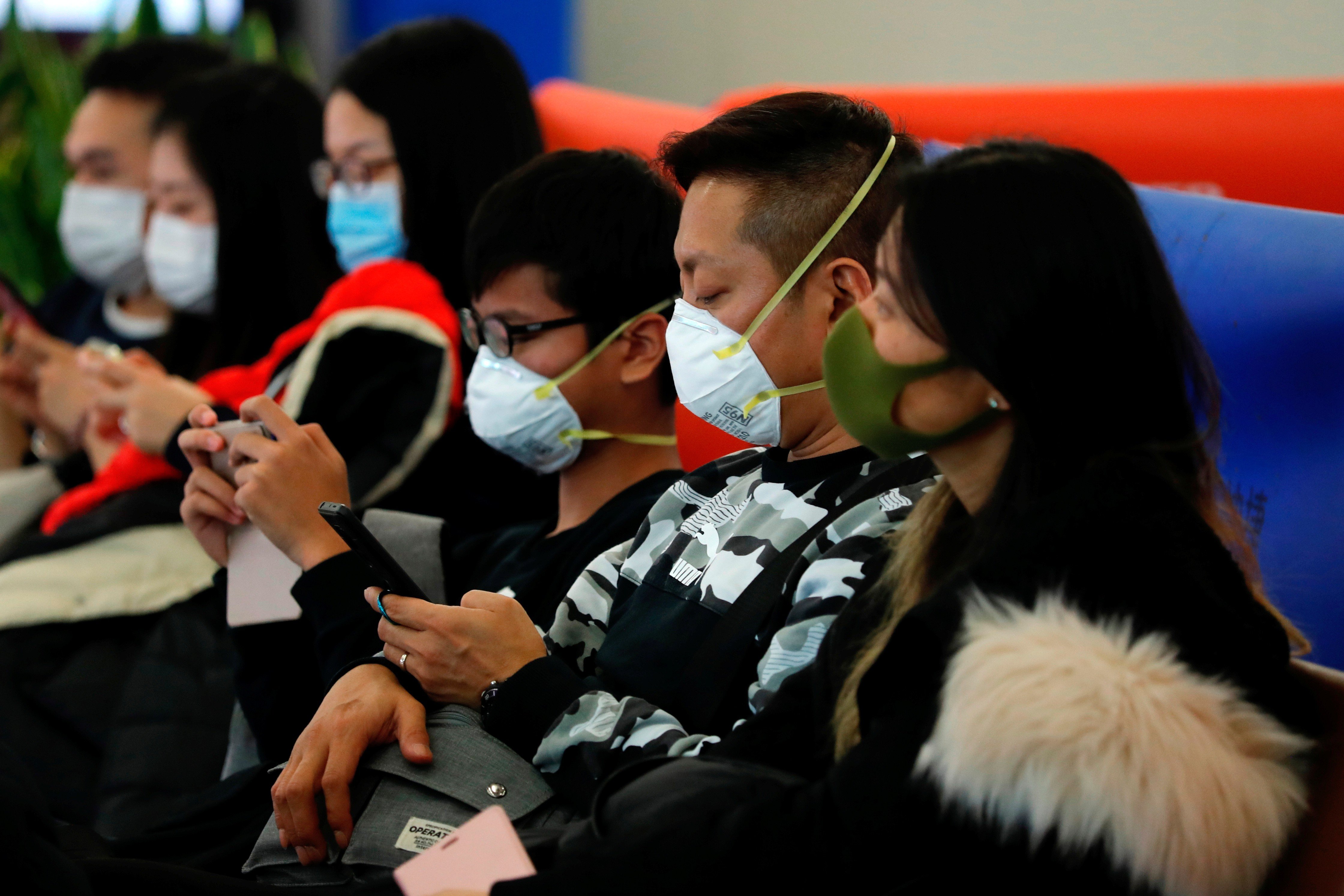 Passengers wear masks at the West Kowloon high-speed railway station as Hong Kong braces itself for a potential mass outbreak of a new coronavirus. Photo: Reuters