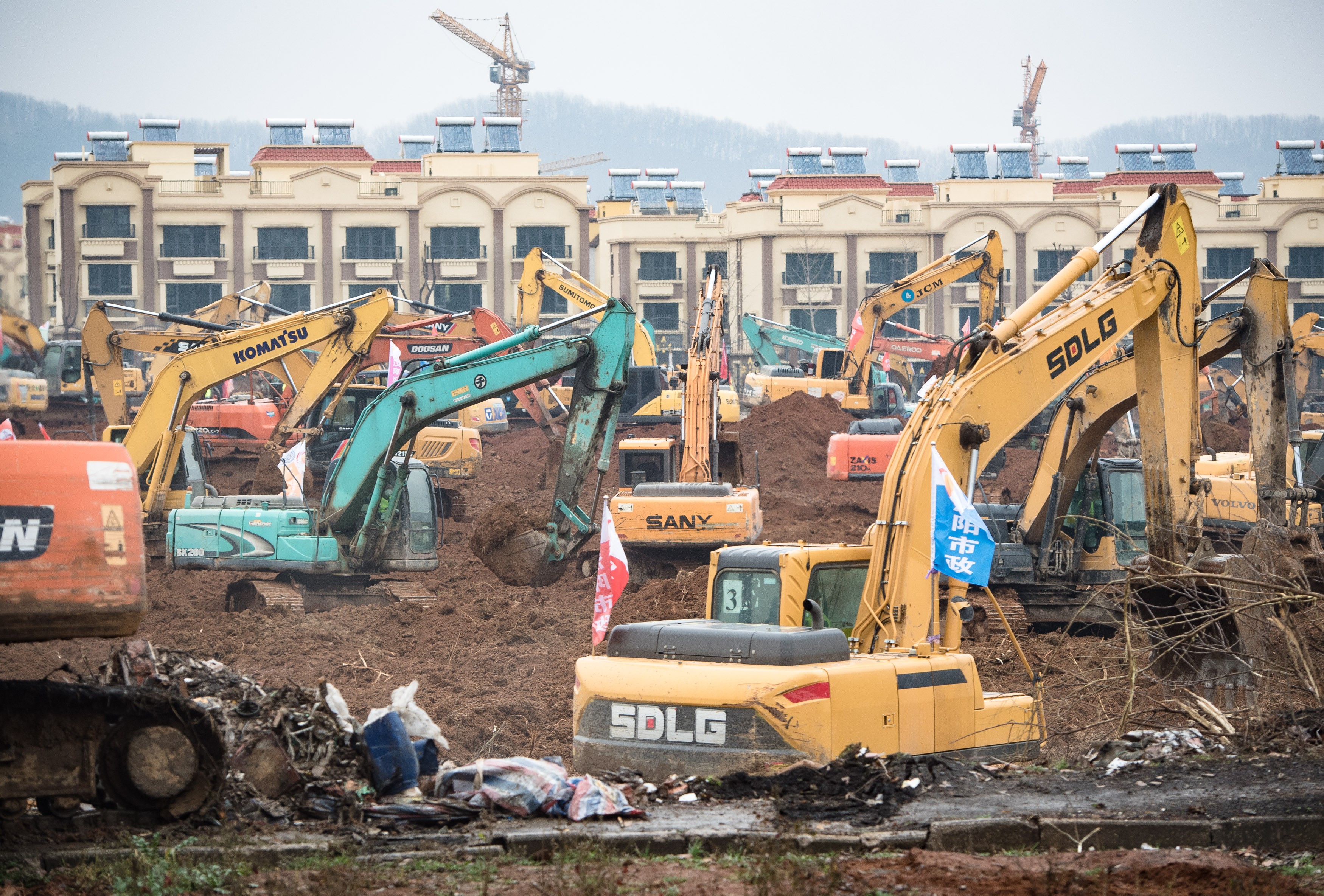 Dozens of excavators break ground for the new coronavirus facility in Wuhan, expected to be completed within six days. Photo: Xinhua