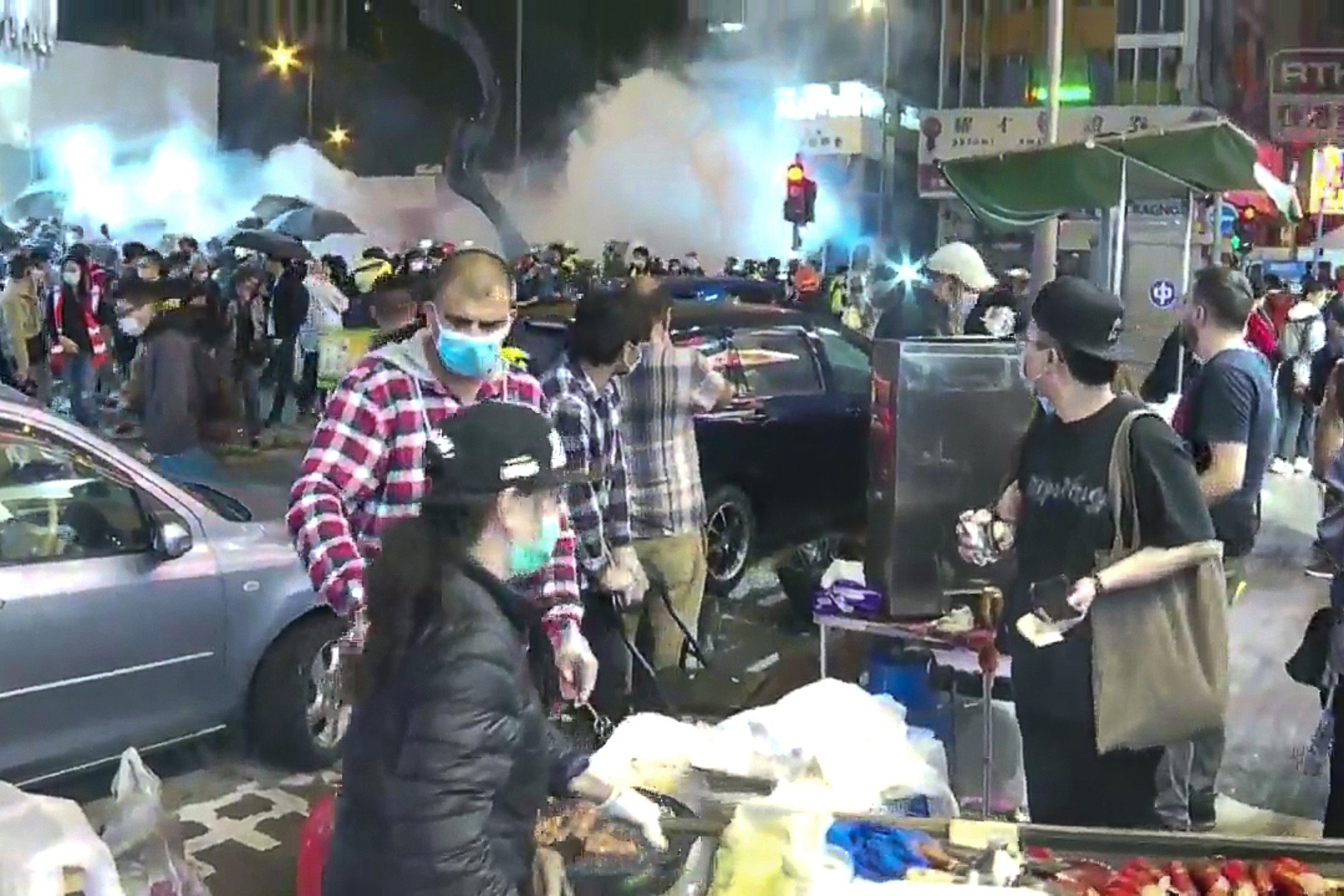 Riot police fire tear gas on Argyle Street near Langham Place in Mong Kok on Saturday January 25, 2020. Photo: RTHK