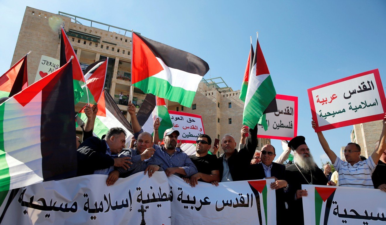 Palestinians protest against the opening of the new US embassy in Jerusalem May, 2018. One banner reads in Arabic ‘Jerusalem Arab, Palestinian, Islamic and Christian’. Photo: Reuters