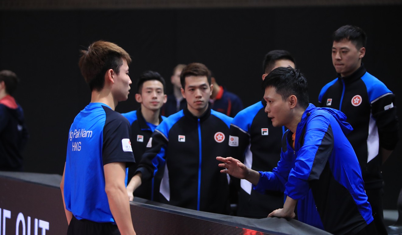 Ng Pak-nam takes advice from coach Leung Chu-yan. Photo: ITTF