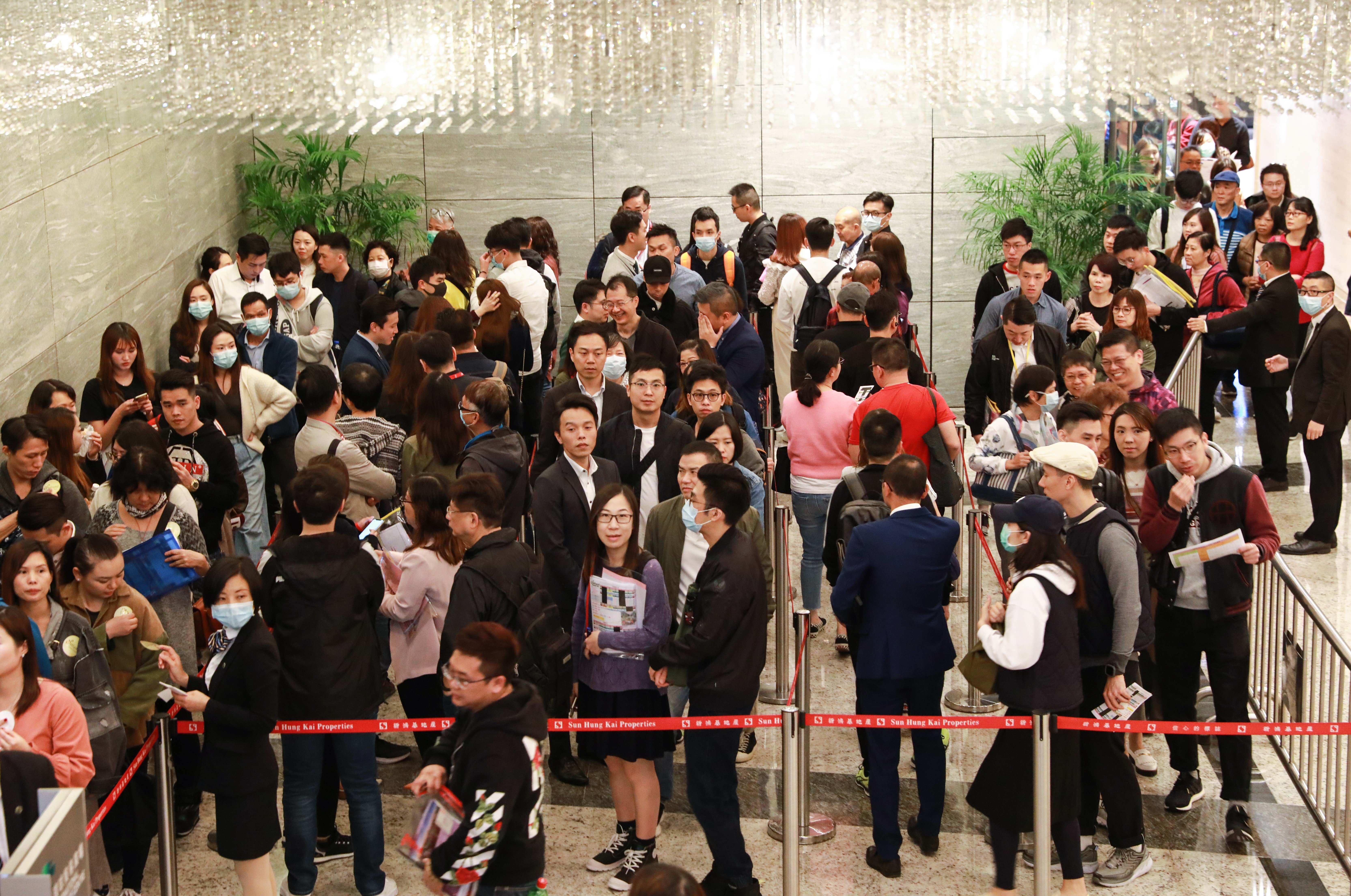 Potential buyers queue up for Sun Hung Kai Properties’ offer of 335 flats at its Wetland Seasons Park residential project, on January 11. Ricacorp expects new flat sales to boost property transactions this year. Photo: May Tse