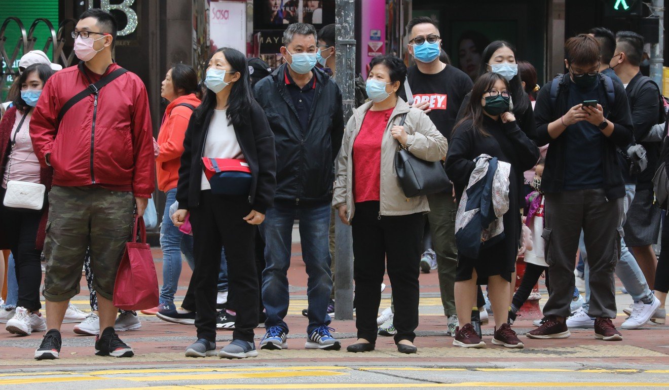 Pedestrians wearing masks are seen at Causeway Bay in Hong Kong as they take precaution against the deadly Wuhan virus outbreak. Ricacorp Properties does not expect a huge impact on the city’s real estate market from the epidemic. Photo: Dickson Lee