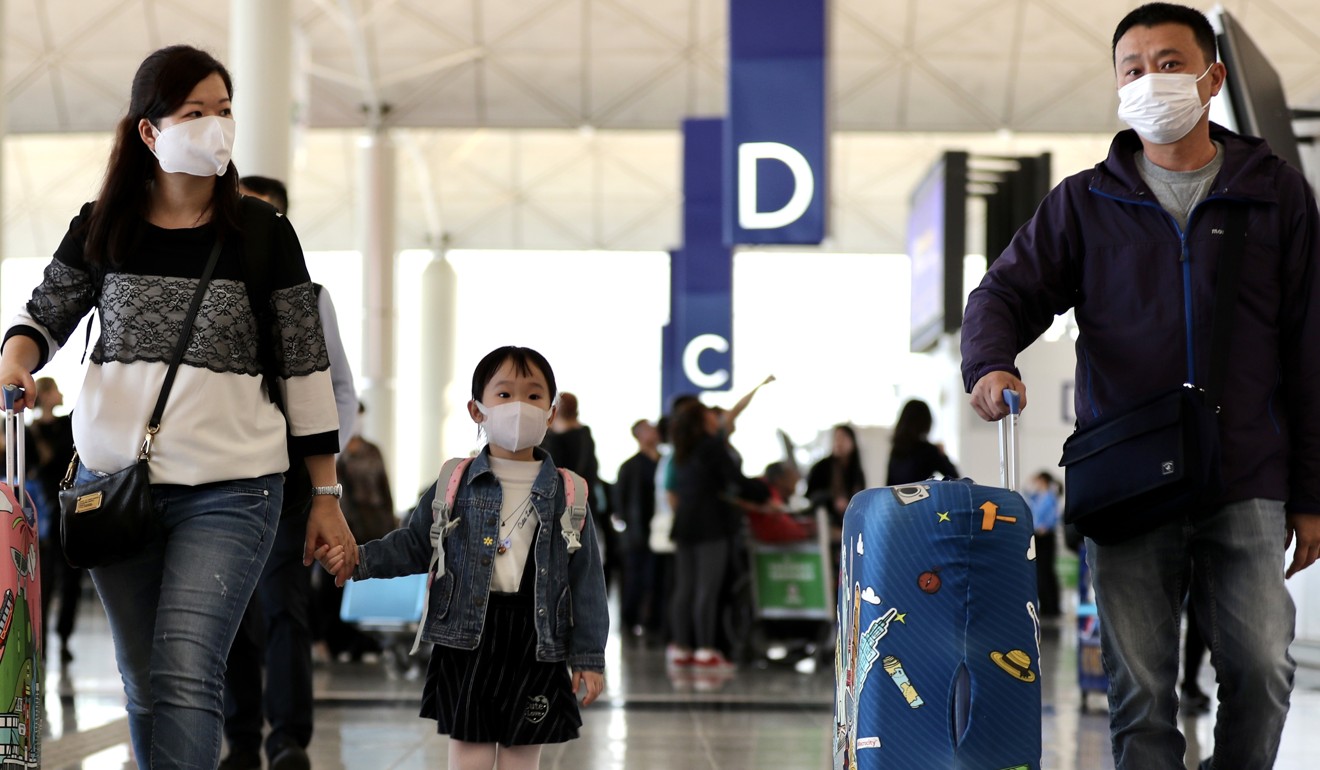 Politicians want the Hong Kong government to consider tougher measures to restrict travellers from regions with virus outbreak from entering the city. Photo: Bloomberg