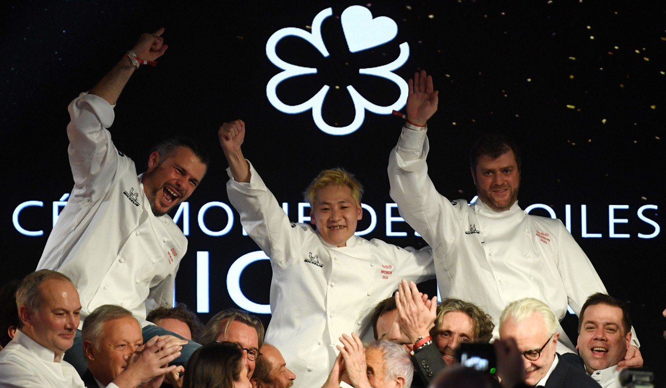 Michelin three-star chefs Glenn Viel (left), Kei Kobayashi (centre) and Christopher Coutanceau celebrate at the guide’s gala event in Paris on Monday. Photo: AFP