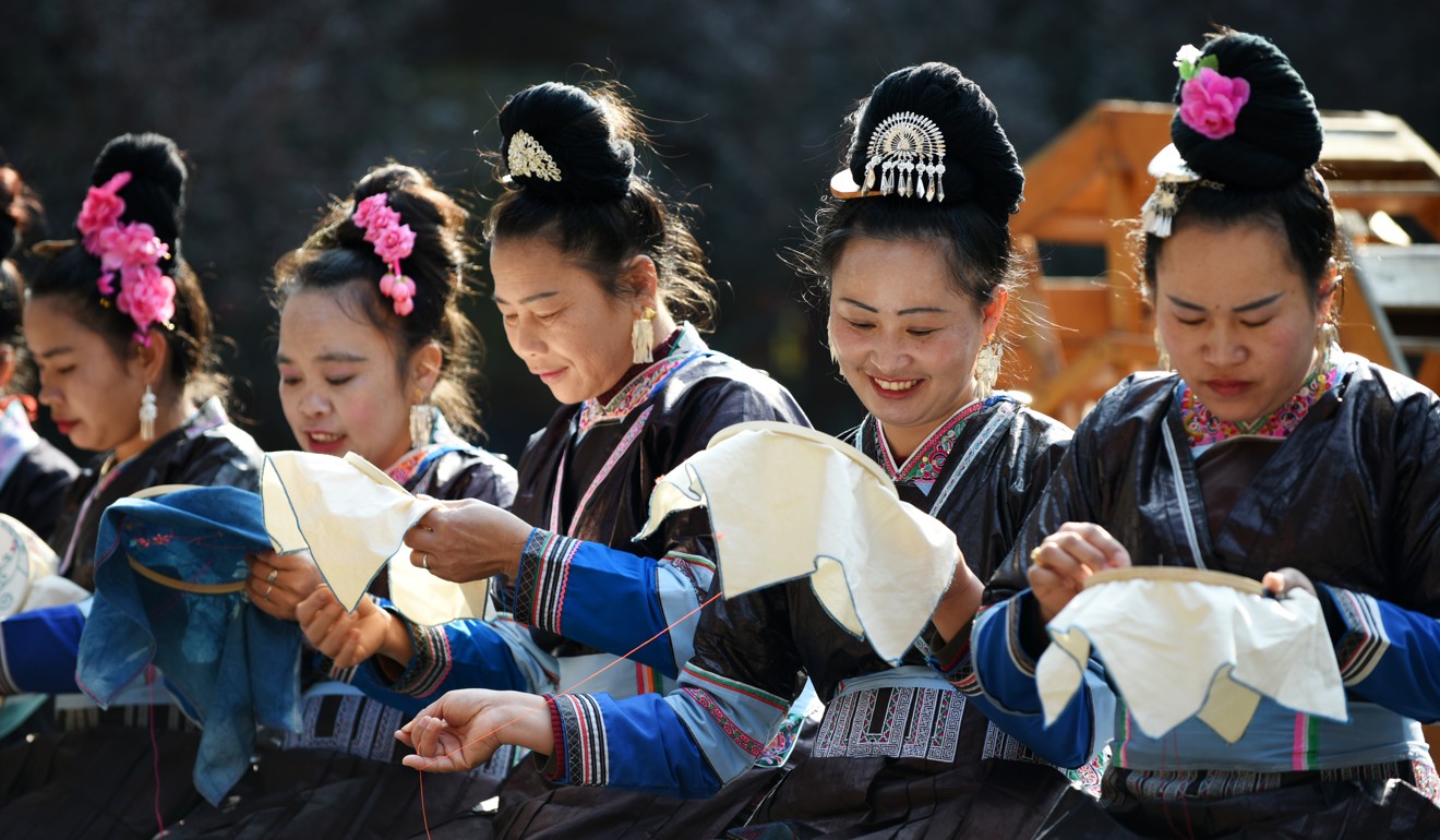 Women of the Dong ethnic group in Guizhou province take part in a poverty alleviation project that provides training on traditional handicrafts. China’s ethnic minorities were exempted from its one-child policy. Photo: Xinhua