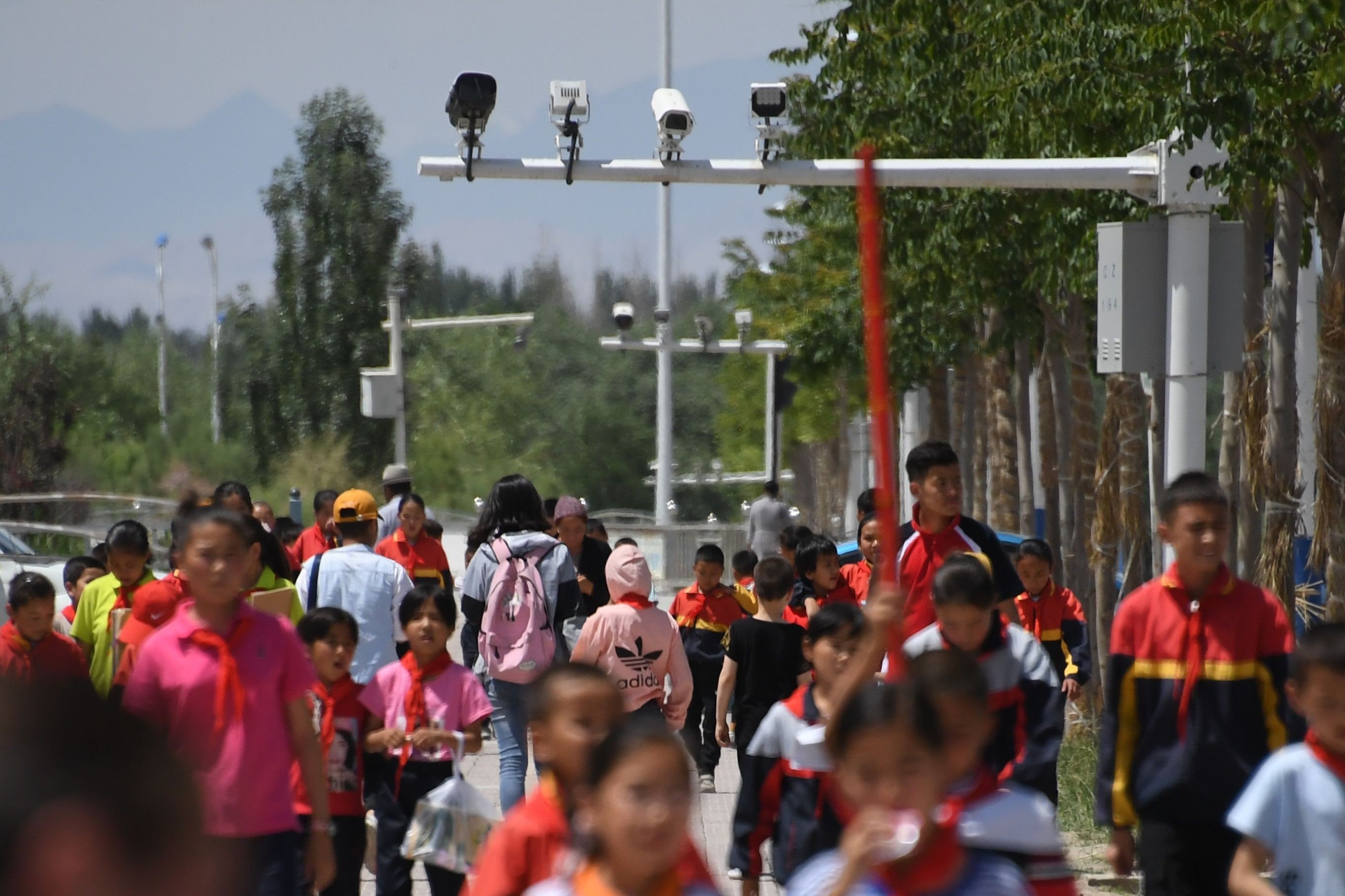 Surveillance cameras loom over a street in Akto, south of Kashgar, in the heavily policed western Xinjiang region. Photo: AFP