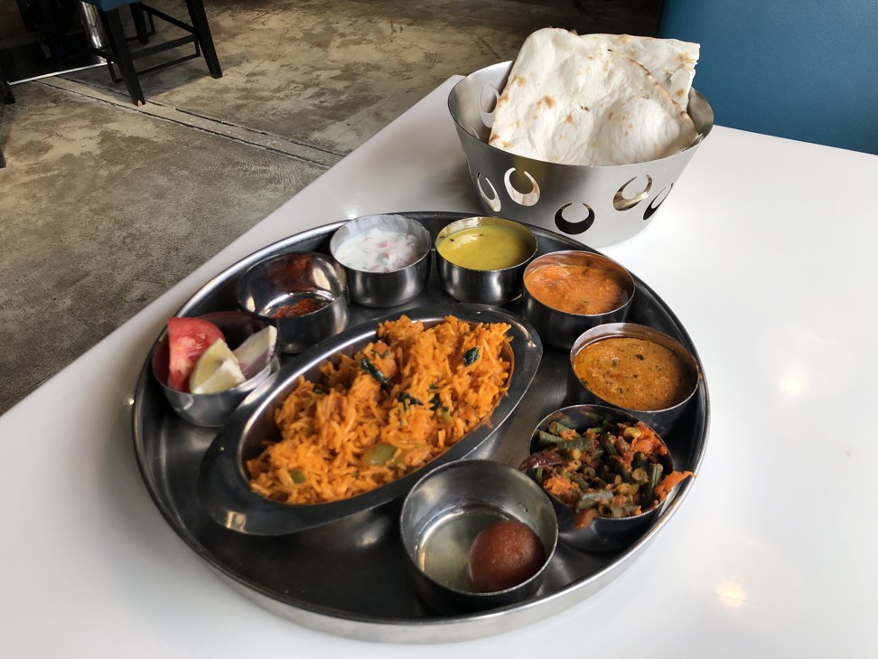 The north Indian thali comes with biryani rice, paneer butter masala, dal butter fry, chana masala, pickles, raita and gulab jamun. Photo: SCMP / Gigi Choy