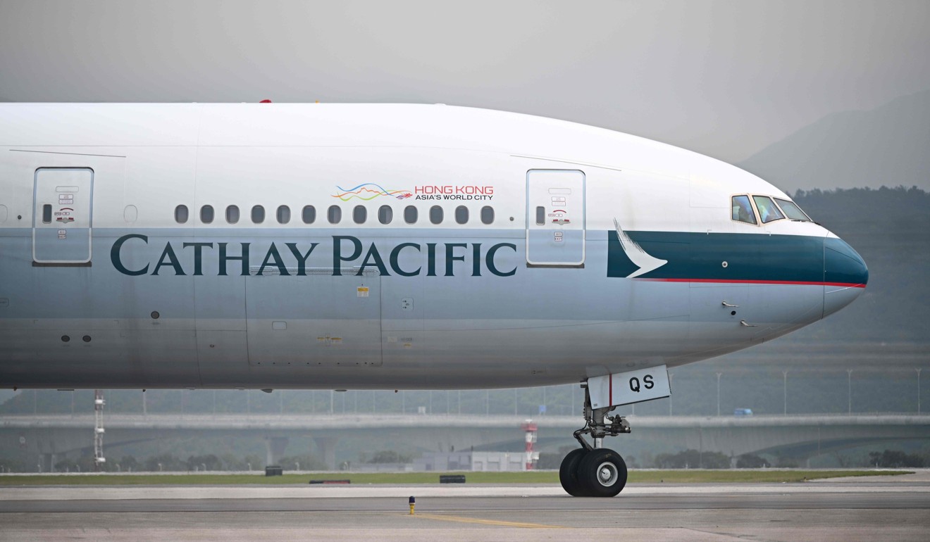 A Cathay Pacific passenger plane prepares to take off from Hong Kong International Airport. Photo: AFP