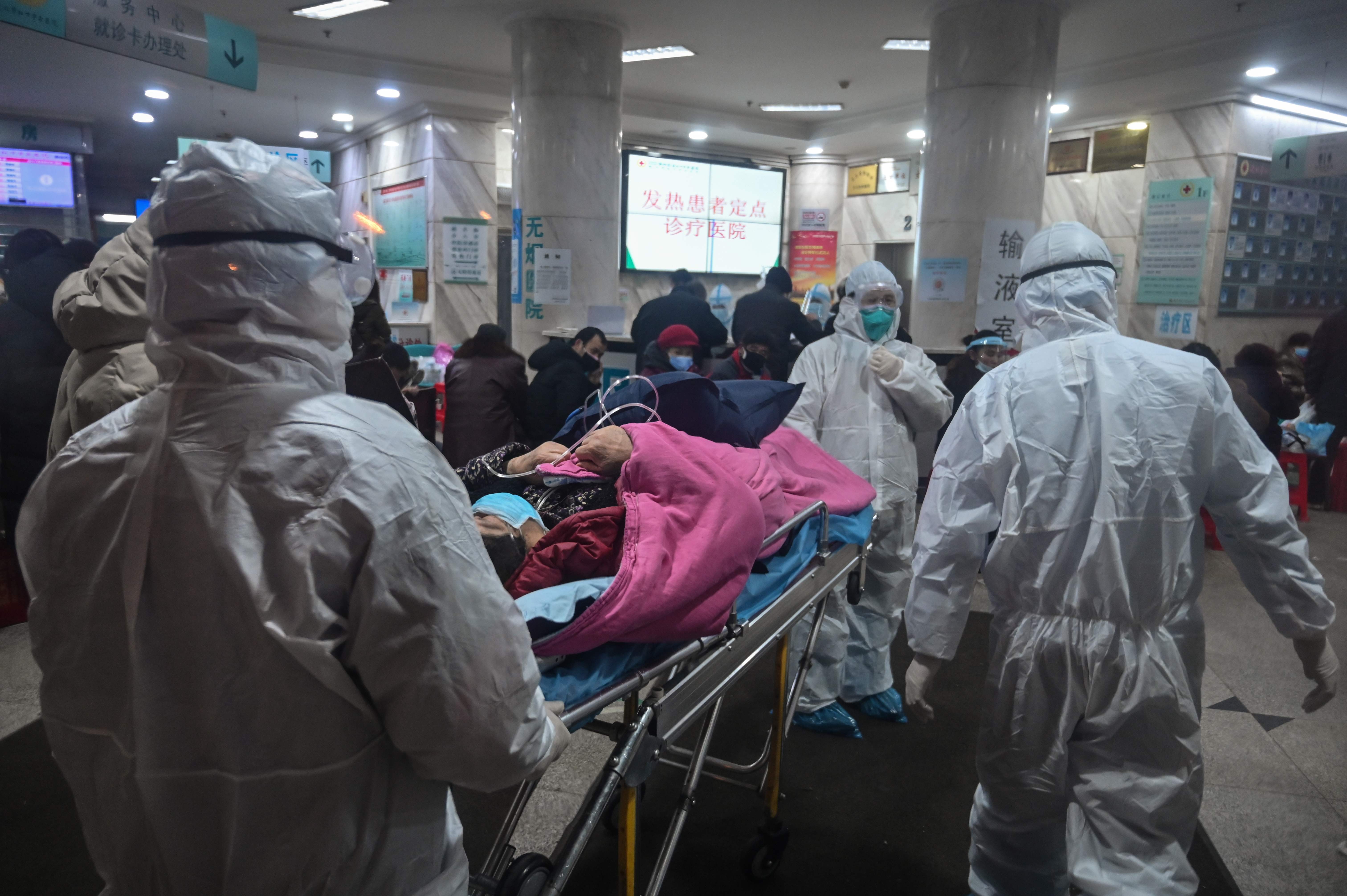 Medical staff admit a new coronavirus patient at the Wuhan Red Cross Hospital in Wuhan. Photo: AFP
