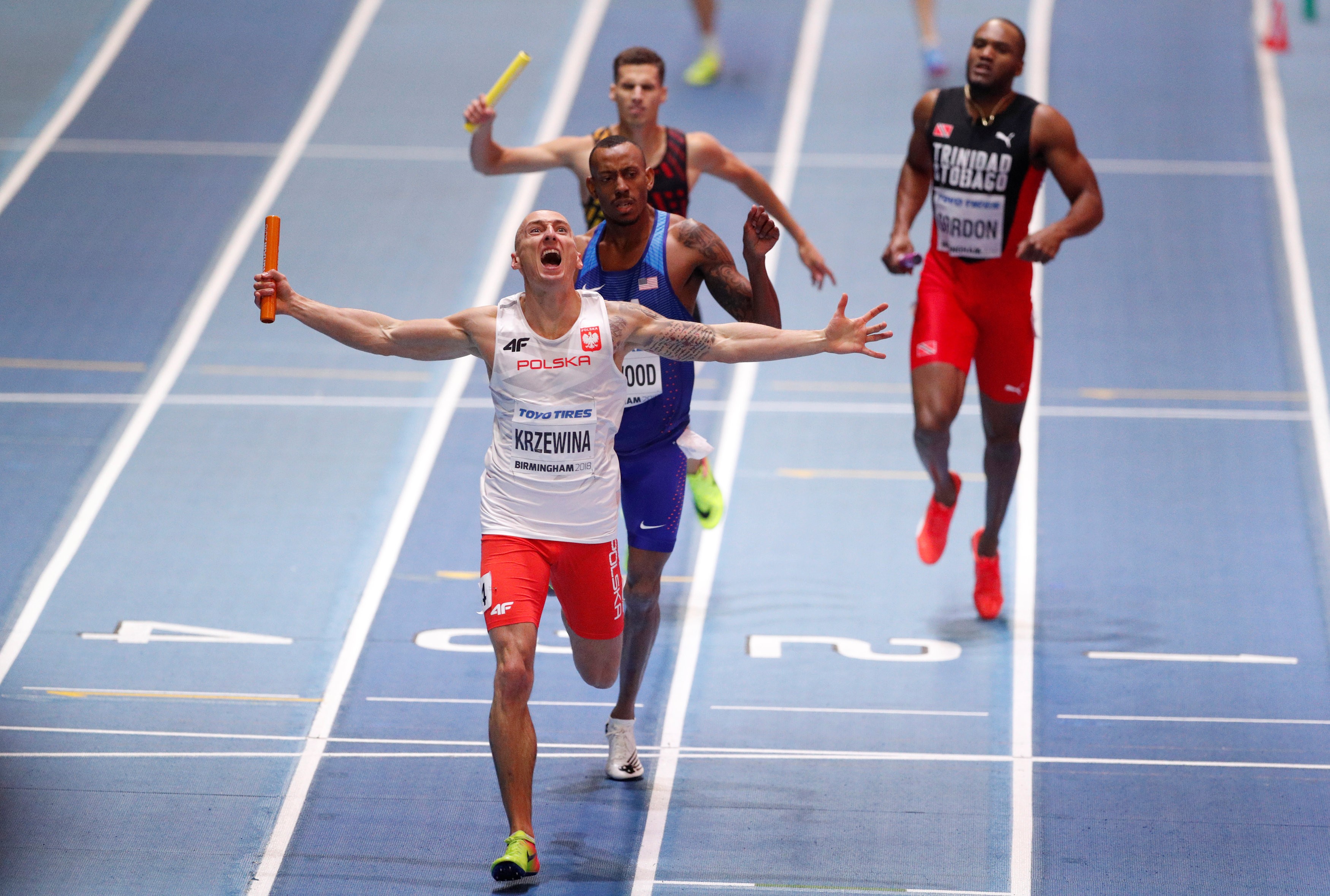Jakub Krzewina of Poland celebrates winning the men's 4x400 metres relay at the IAAF World Indoor Championships in 2018. Photo: Reuters