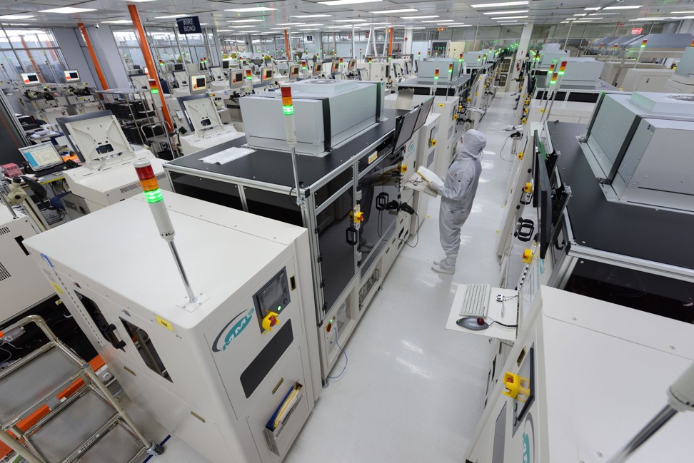 A worker looks at a monitor at Globetronics factory in Penang, Malaysia. Photo: Globetronics