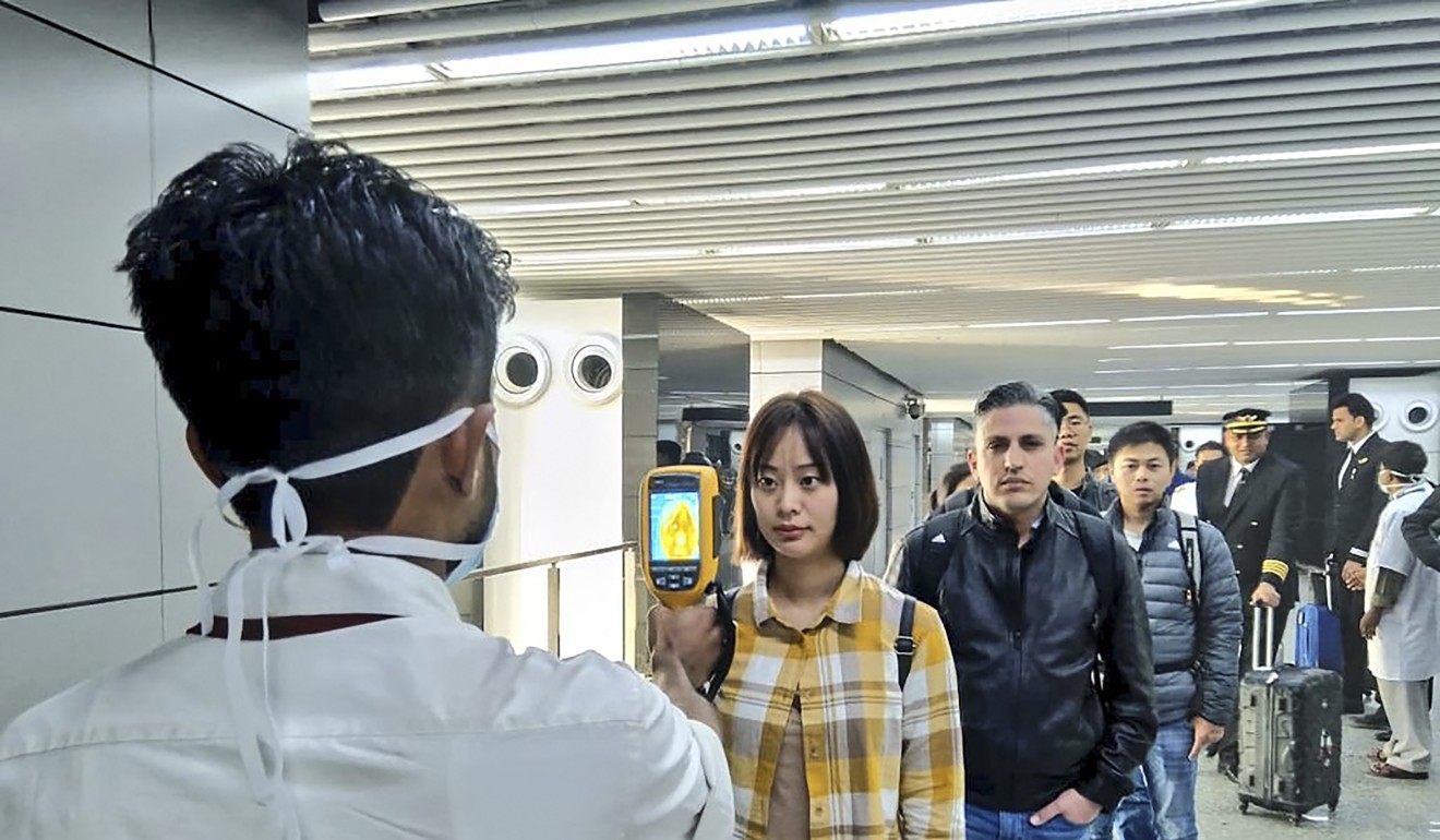 Passengers are screened at the Netaji Subhash Chandra Bose International Airport in Kolkata, India, as a precaution against the coronavirus. Photo: Handout