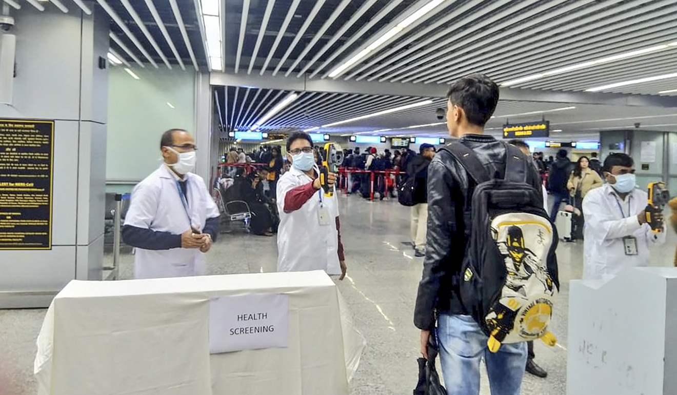 A passenger is screened at the Netaji Subhash Chandra Bose International Airport in Kolkata, India, as a precaution against the coronavirus. Photo: Handout