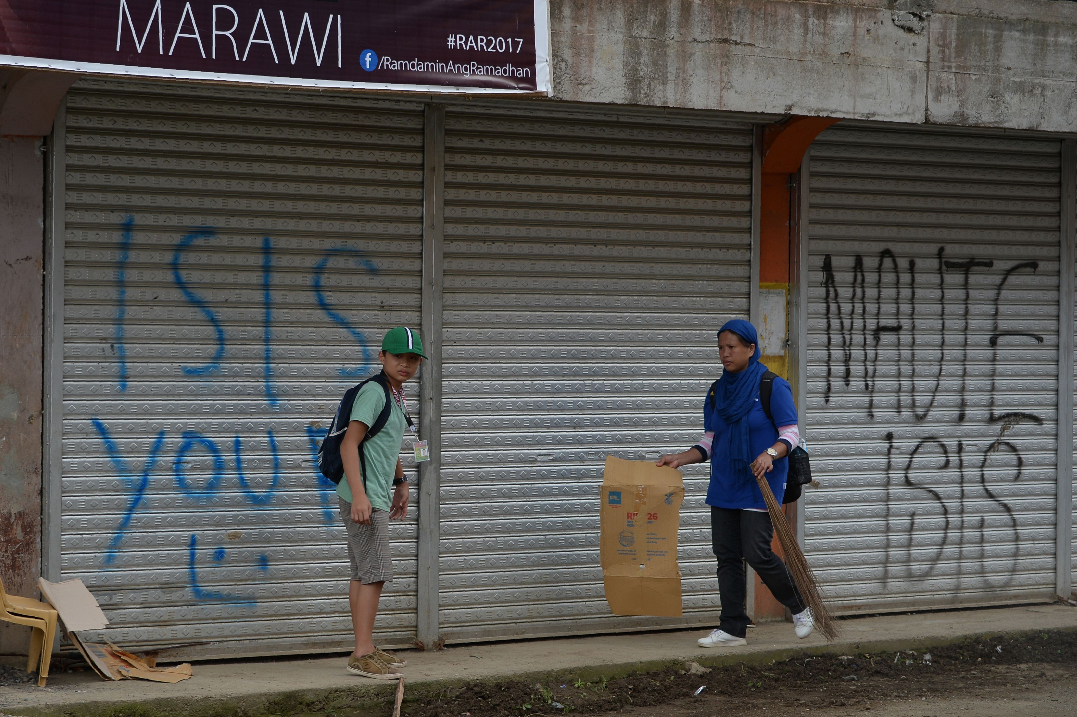 Shops in the Philippines sprayed with pro-Islamic State graffiti. Photo: AFP