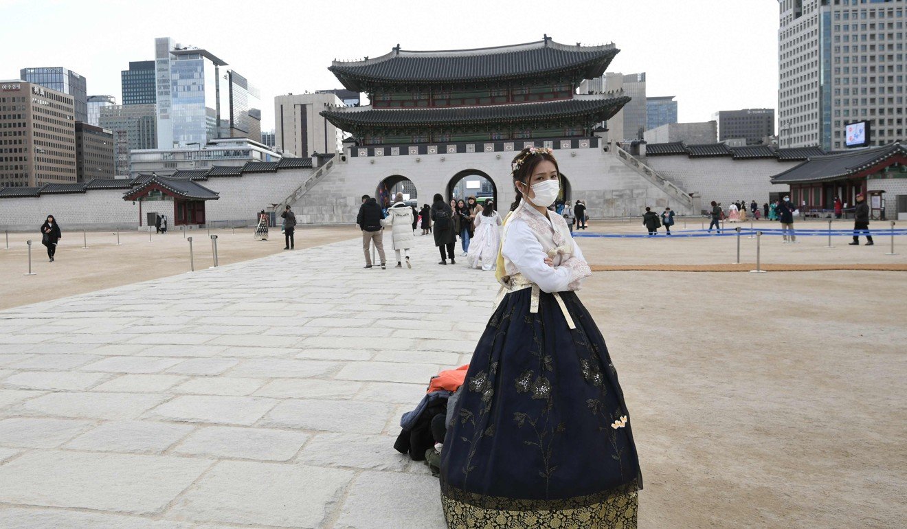 A woman in traditional Korean hanbok dress visits the Gyeongbokgung palace in Seoul. Photo: AFP