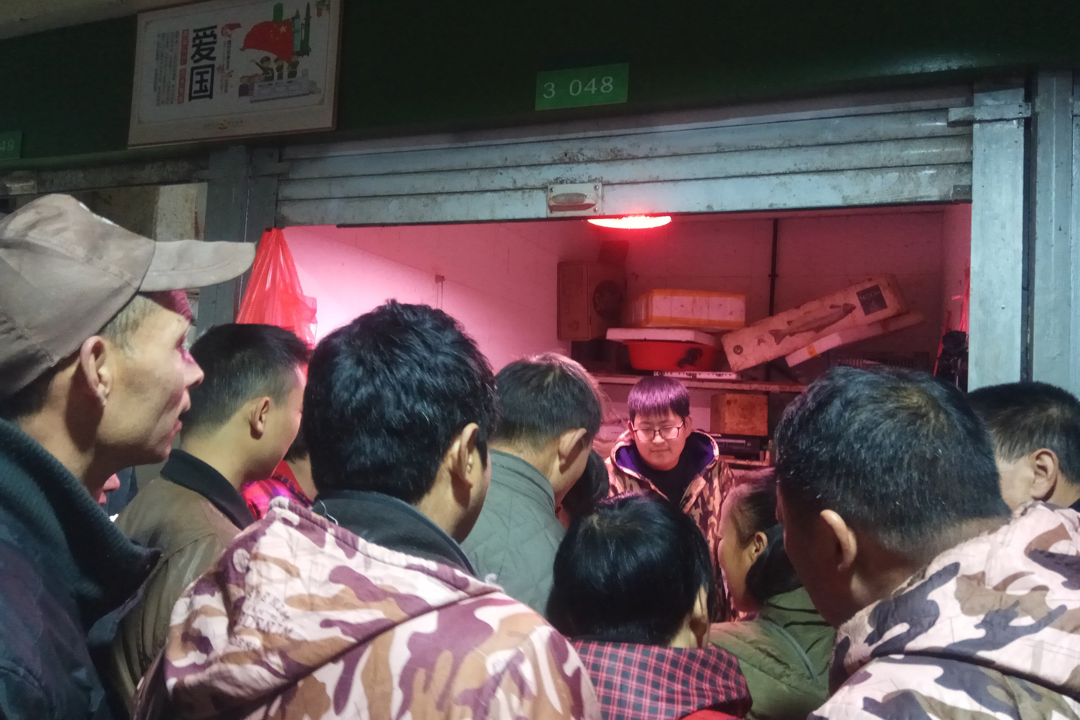 Customers line up outside a store suspected of selling trafficked wildlife in Anji city in Zhejiang on January 17. Chinese law allows the captive breeding of wildlife for commercial purposes, provided that companies obtain a licence from provincial authorities. But such licences are often used to cover up illegal trade. Photo: Anti-Poaching Special Squad via AP