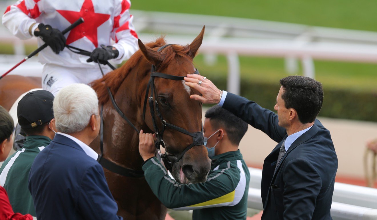 Douglas Whyte rubs Inner Flame’s head after winning at Sha Tin.