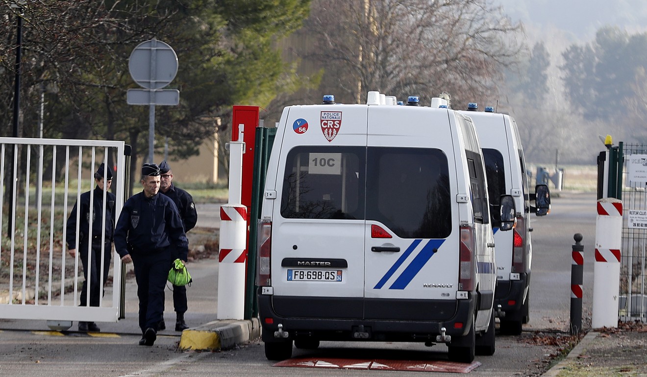French police officers gather at the entrance gate of the ENSOSP (French National Fire Officers Academy) where French citizens will be quarantined after their repatriation from Wuhan. Photo: EPA-EFE