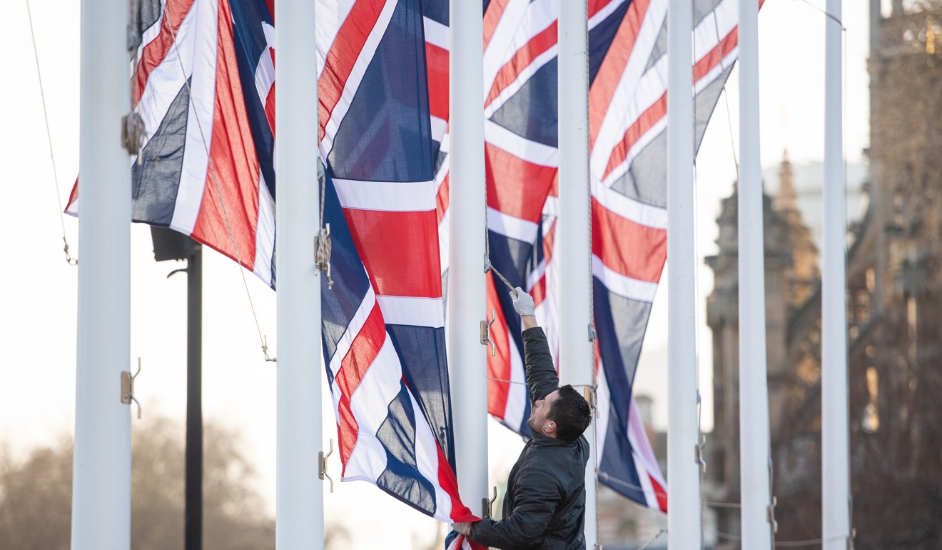 British flags are removed following events to mark the UK’s departure from the EU. Photo: DPA