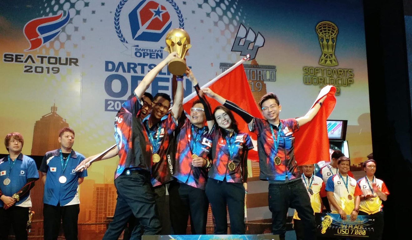 Kevin Leung celebrates a victory with the Hong Kong team.
