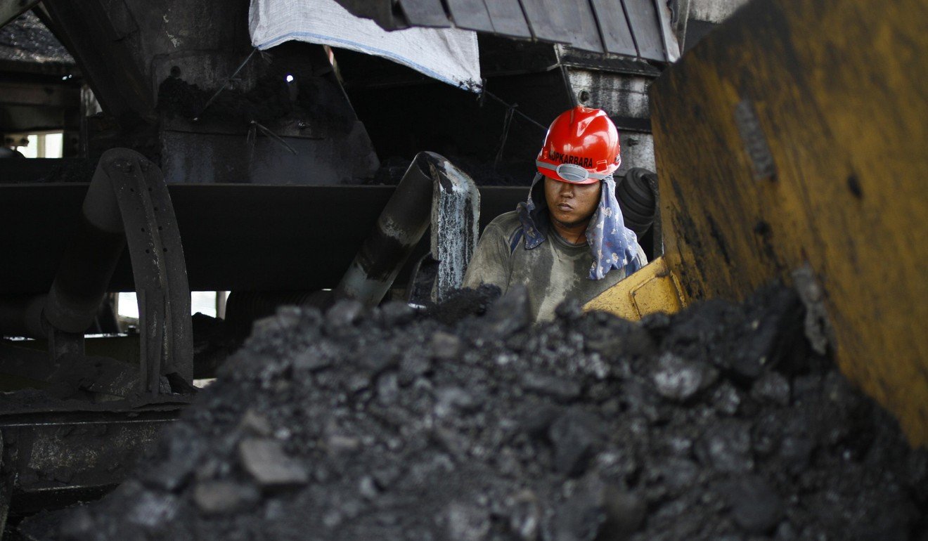 A worker at the Tarahan coal port in Lampung province, Indonesia. Photo: Reuters