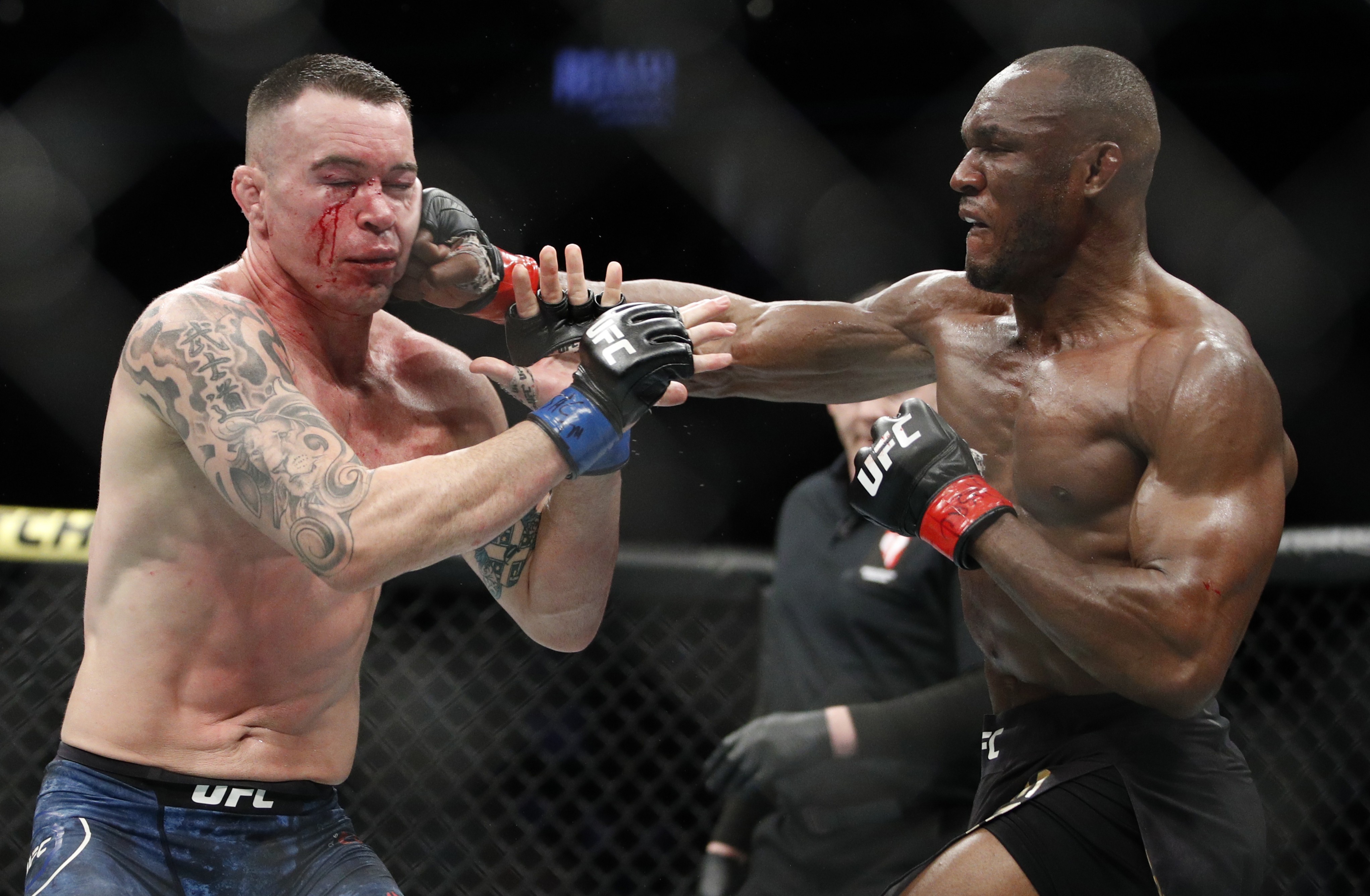Kamaru Usman (right) hits Colby Covington in their welterweight championship fight at UFC 245 in December. Photo: AP