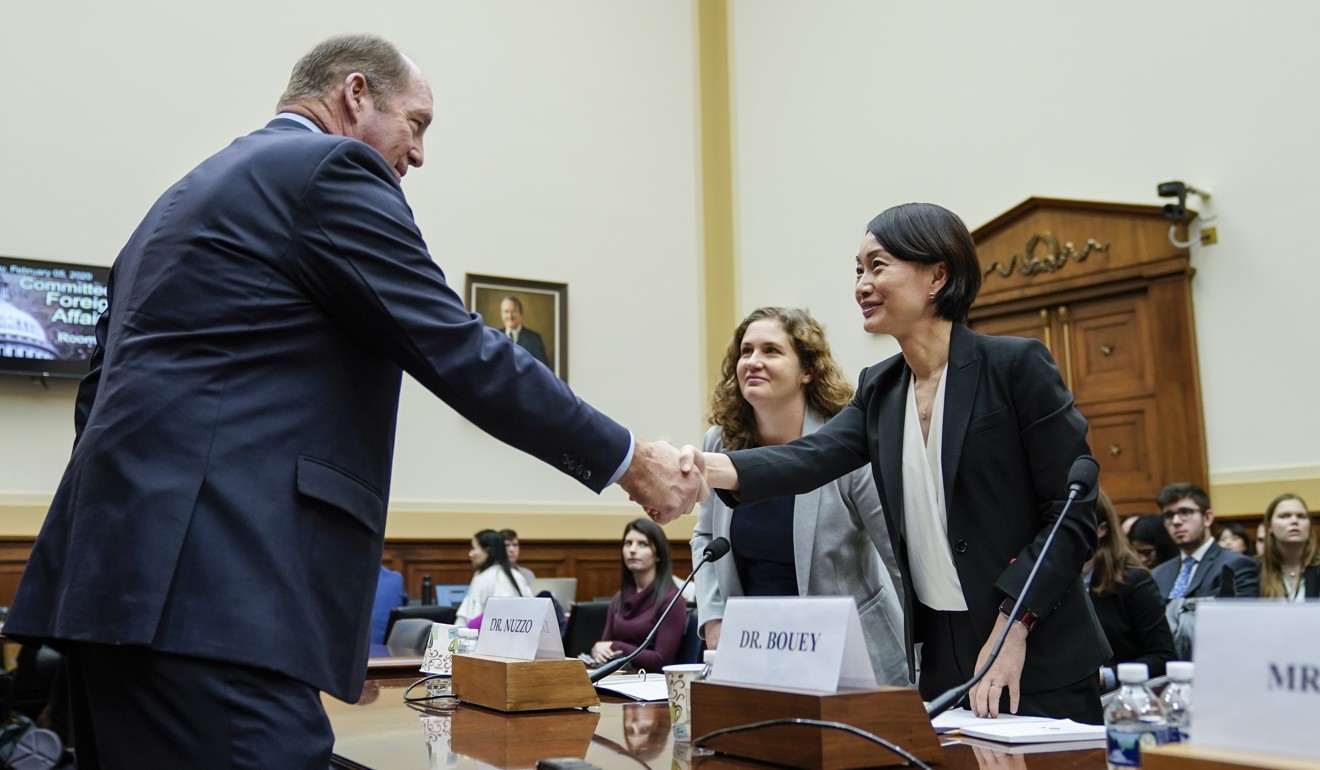 Representative Ted Yoho, Republican of Florida, greets Dr Jennifer Bouey, an epidemiologist and China policy specialist at the RAND Corporation, before the congressional hearing on Wednesday. Photo: Getty Images/AFP