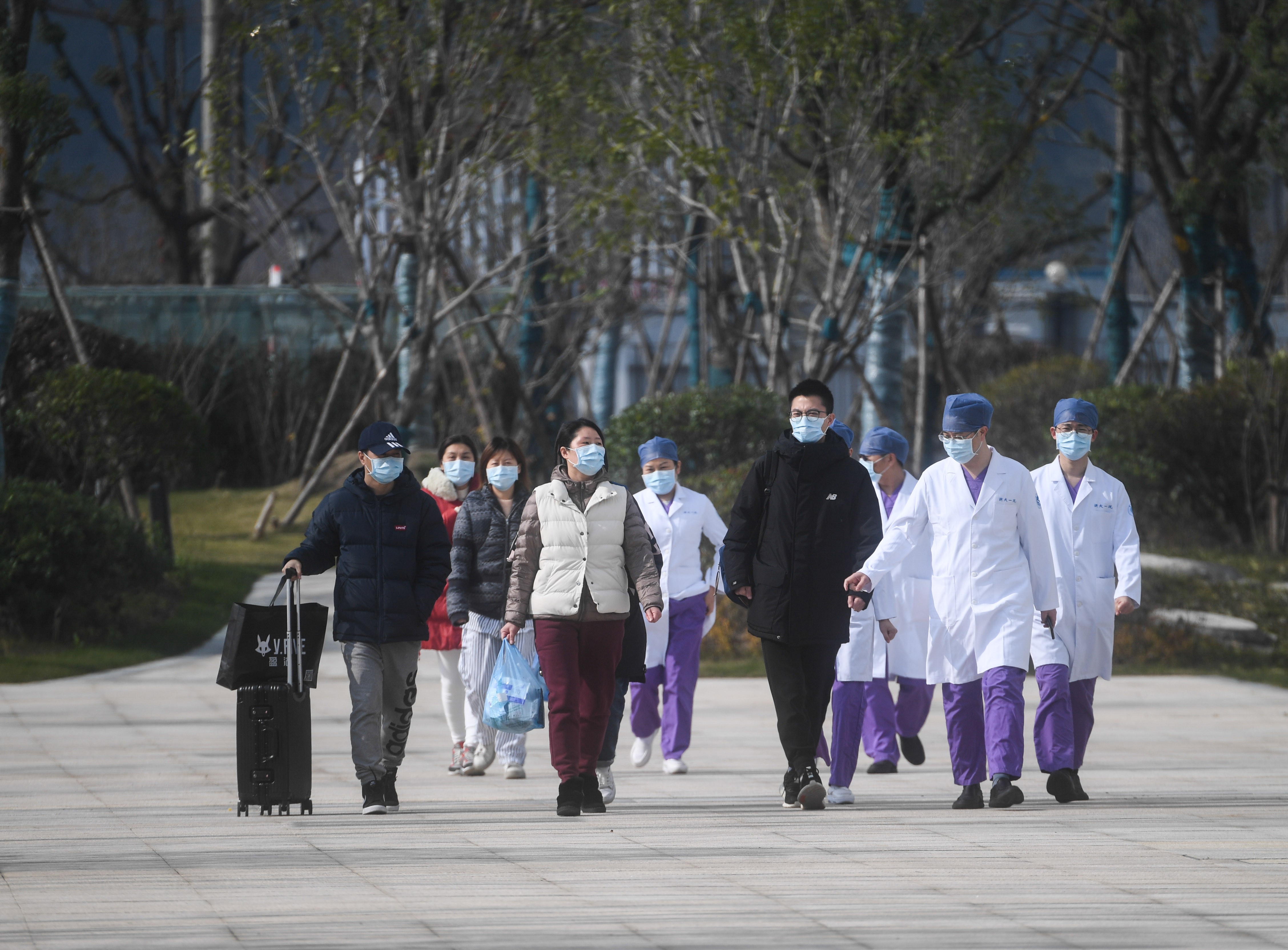 Cured coronavirus patients leave hospital in Hangzhou, one of four cities in the eastern Chinese province of Zhejiang which has adopted draconian quarantine measures for its residents. Photo: Xinhua