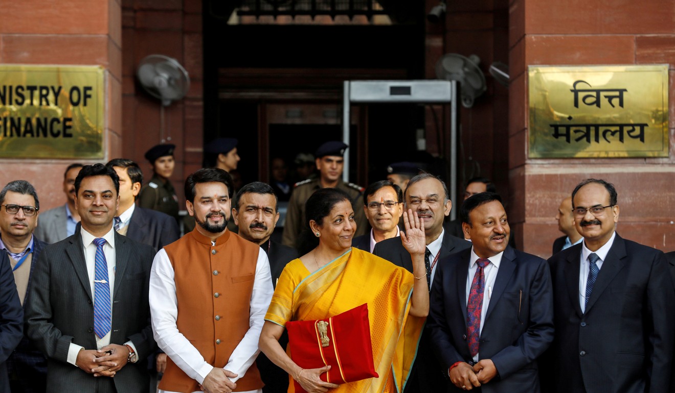 India’s finance minister Nirmala Sitharaman holds budget papers as she leaves her office to present the federal budget in the parliament in New Delhi. Photo: Reuters
