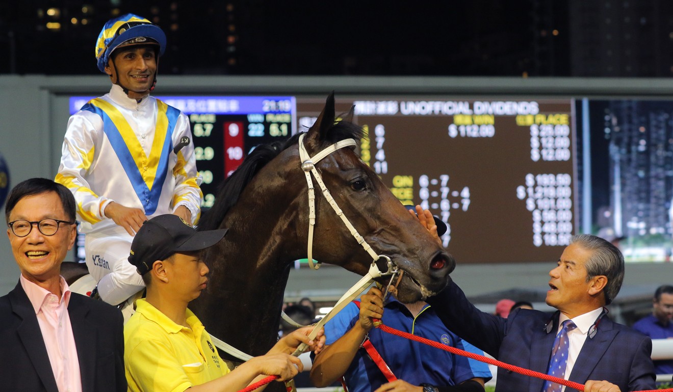 Tony Cruz (right) with Hong Kong Bet after a win.