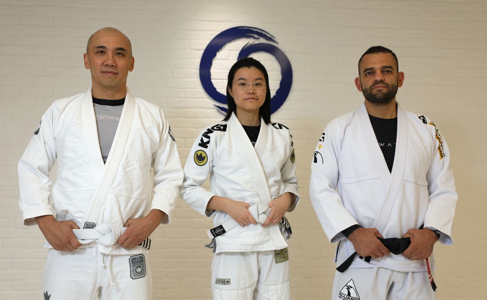Hannah Tsang (centre) has been practising Brazilian jiu-jitsu for the last two years. Her father, Stephen Tsang (left) also practises the sport, coached by Fernando Junior (right). Photo: Xiaomei Chen