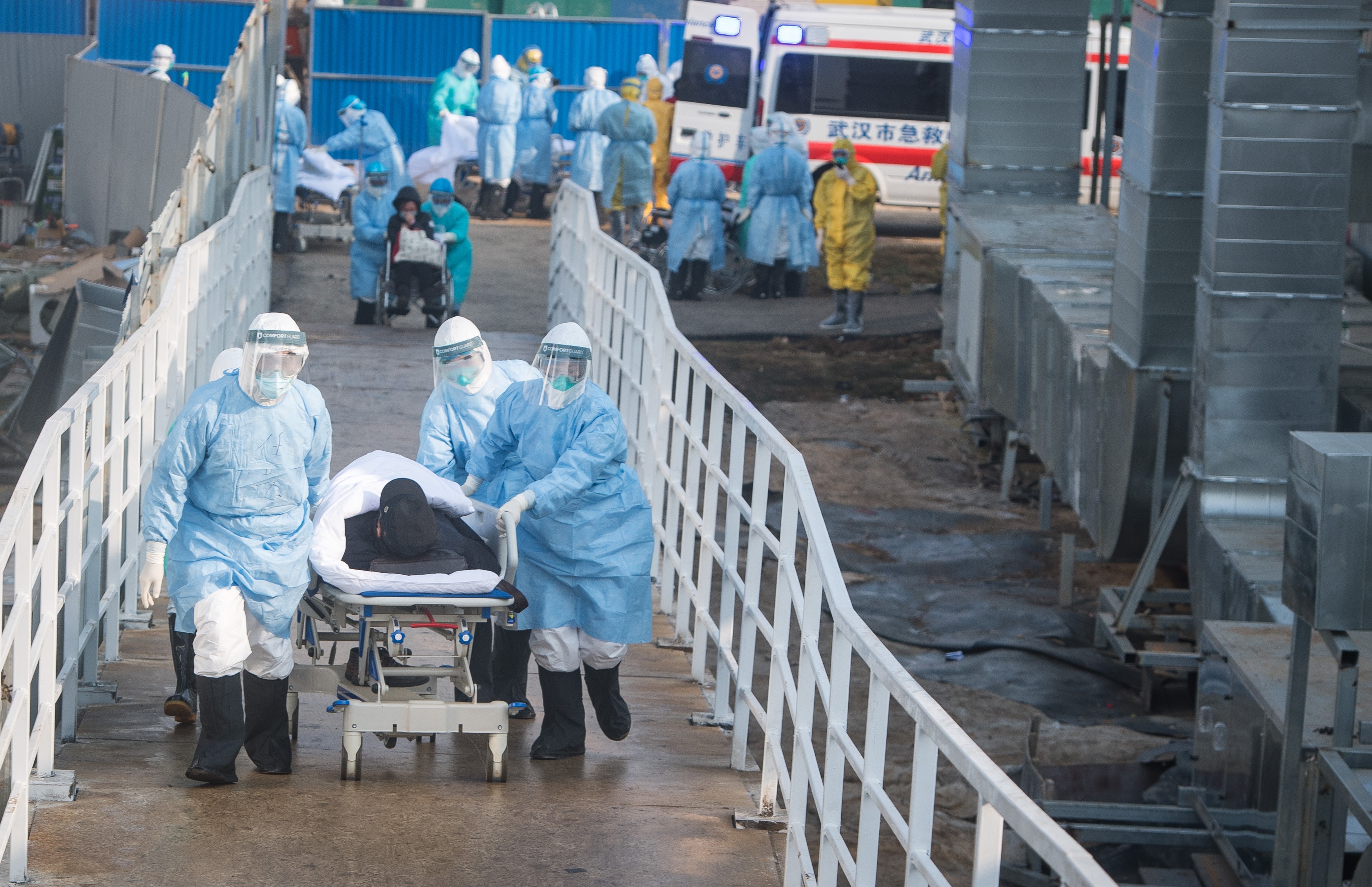 Medical workers take coronavirus patients to their isolation wards at the newly built Huoshenshan Hospital in Wuhan, central China's Hubei Province. Photo: Xinhua