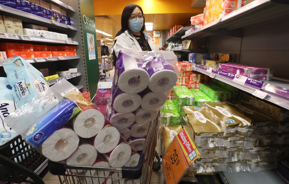 A shopper stocks up on sanitary products at the Taste supermarket in Wan Chai, amid the coronavirus outbreak on 5 February 2020. Photo: Nora Tam