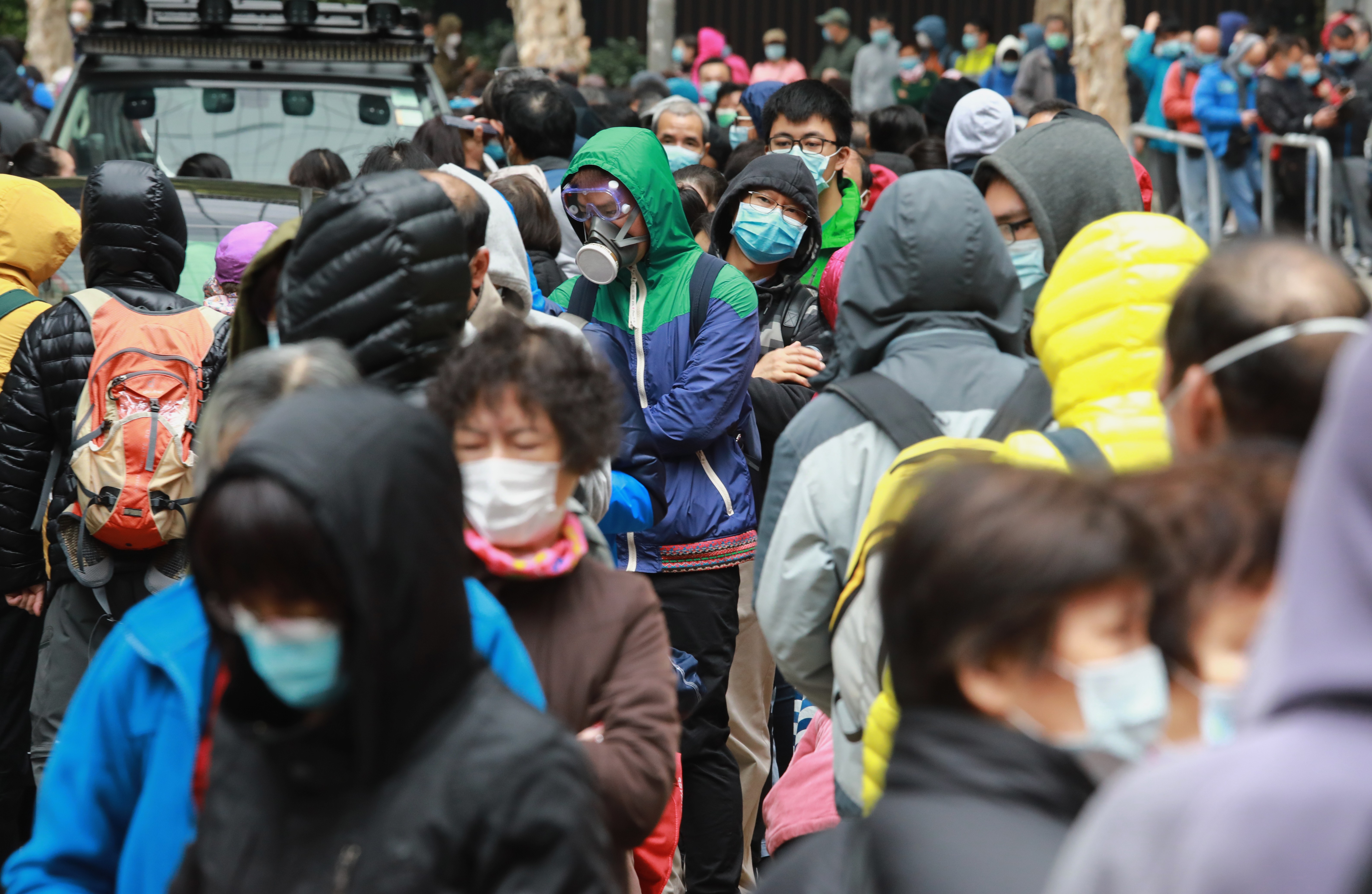 People queue up to buy face masks in Kowloon Bay on February 5, amid a shortage as the novel coronavirus hits Hong Kong. Photo: May Tse
