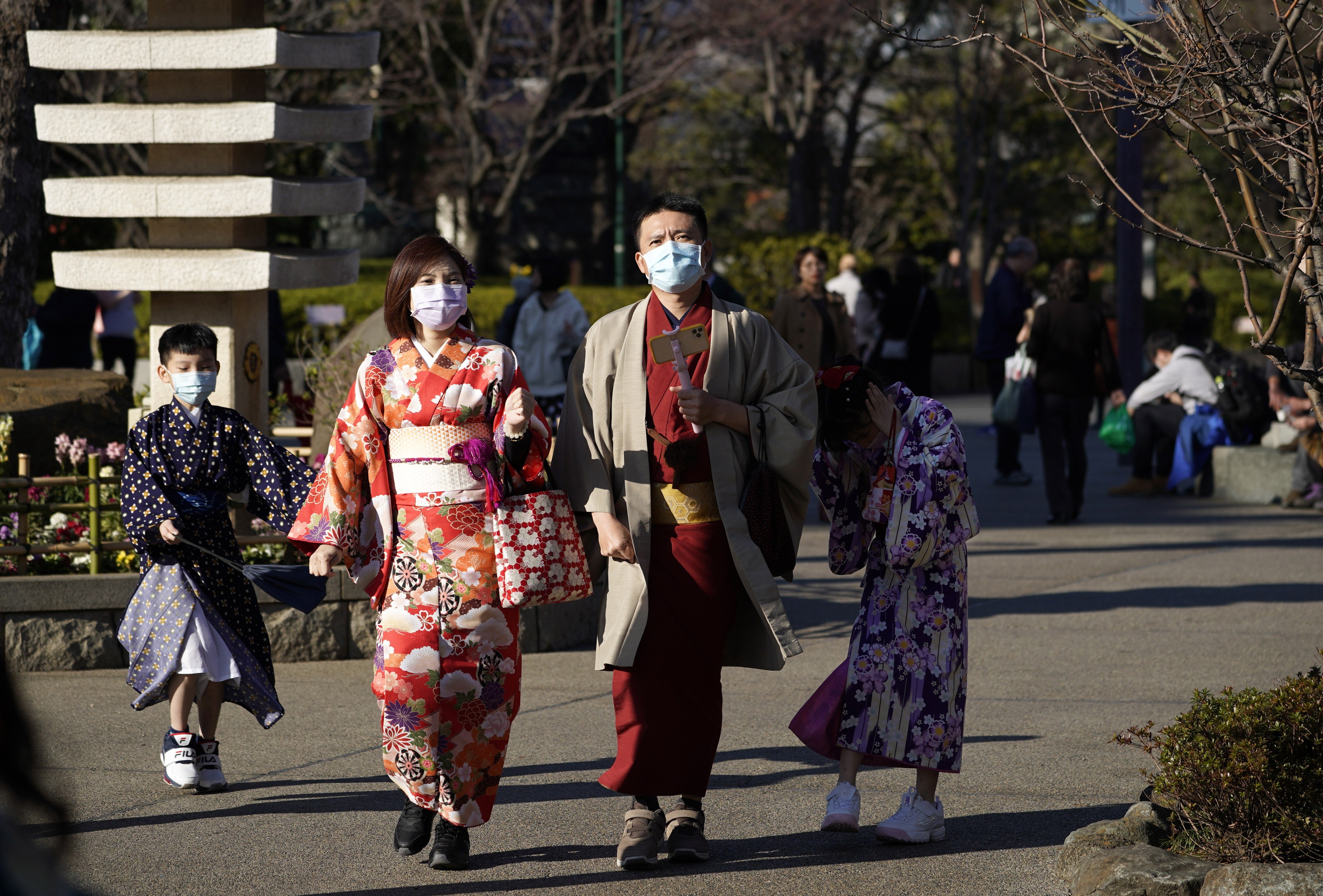 Tourists wearing masks visit the Sensoji temple in Tokyo, on January 30. Japan’s Prime Minister Shinzo Abe has said the Tokyo Olympic Games will go ahead despite novel coronavirus fears. Photo: EPA-EFE