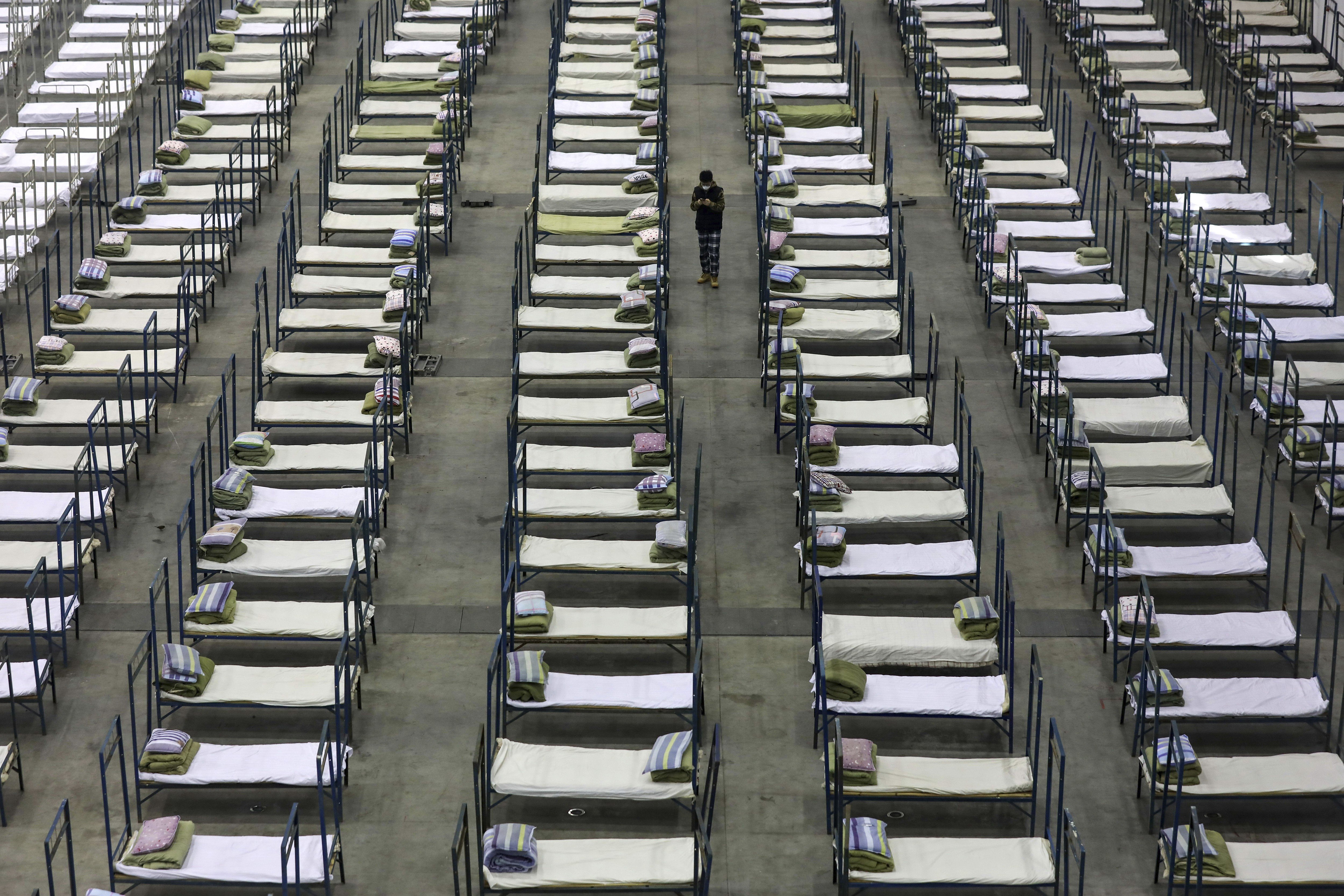 Beds in a convention centre that has been converted into a temporary hospital in Wuhan, central China's Hubei Province. Photo: AP