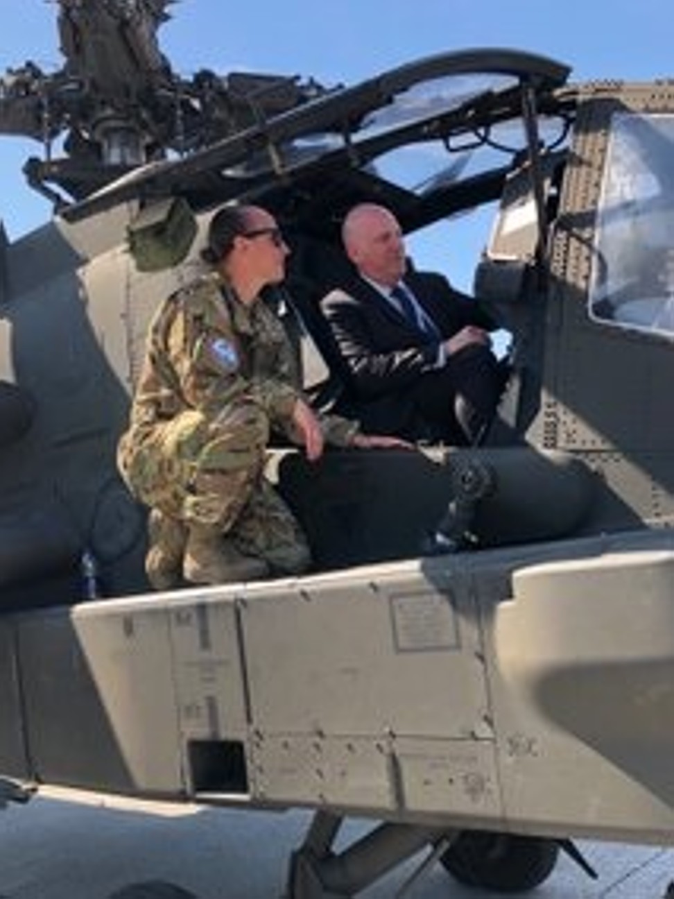 Cooper aboard a US attack helicopter. Photo: US Department of State