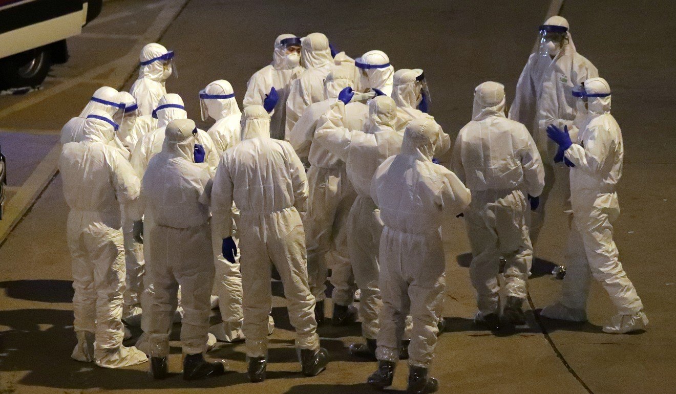 Medics at the Hong Mei House on the Cheung Hong Estate, in Tsing Yi, Hong Kong, where two people have been confirmed to have the coronavirus. Photo: Edmond So