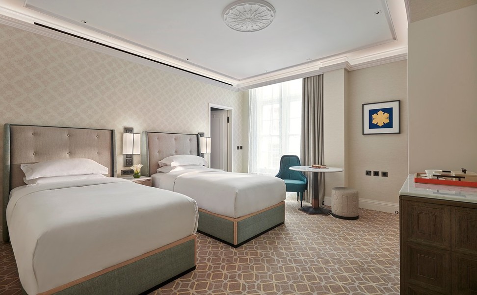 The rooms enjoy understated interiors that pop with flashes of blue. Photo: Great Scotland Yard Hotel